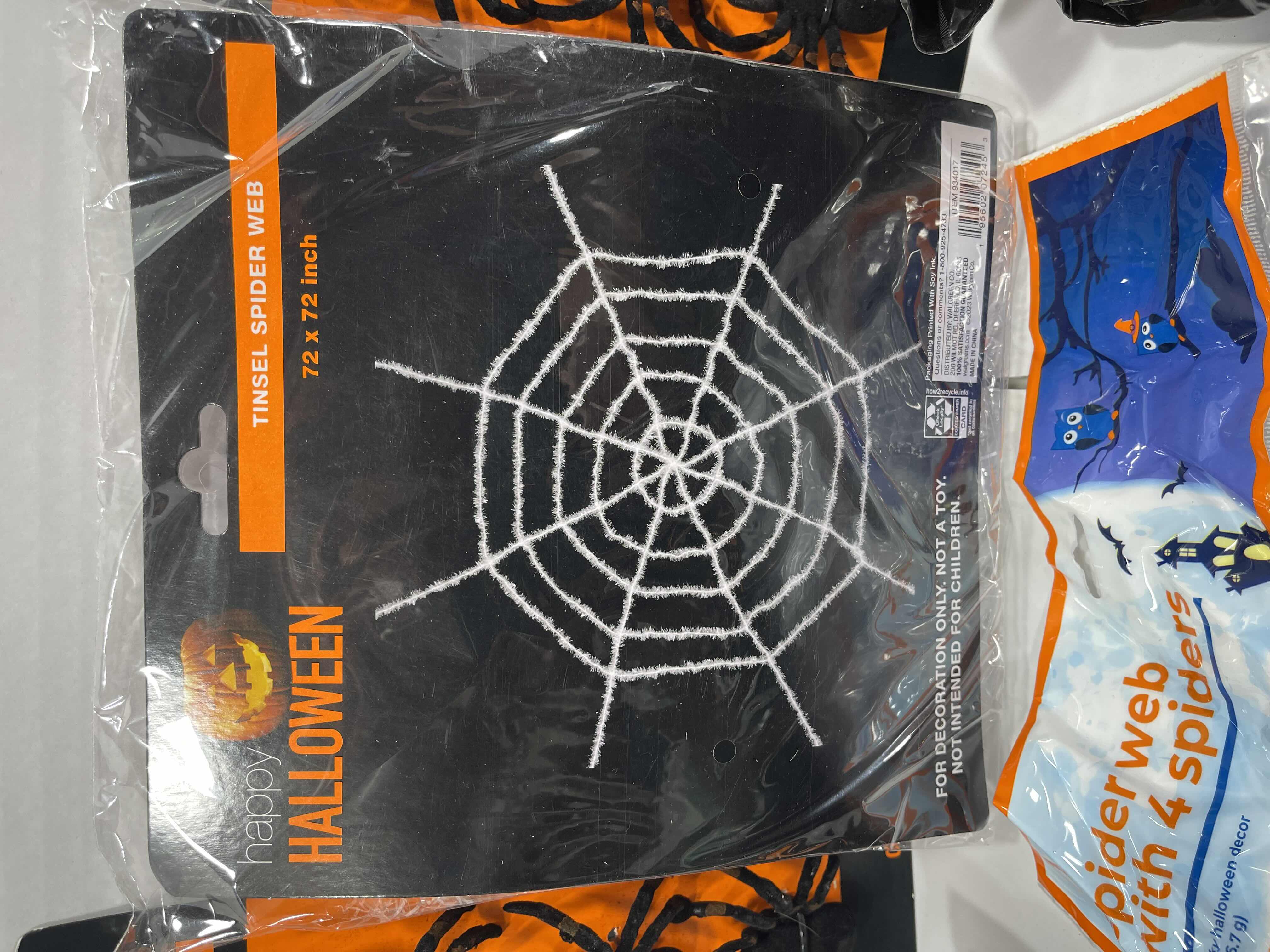 Photo 1 of SPIDER WEB LOT (9 BAGS), TINSEL SPIDER WEB 72” X 72” & FLOCKED SPIDERS (12 COUNT)