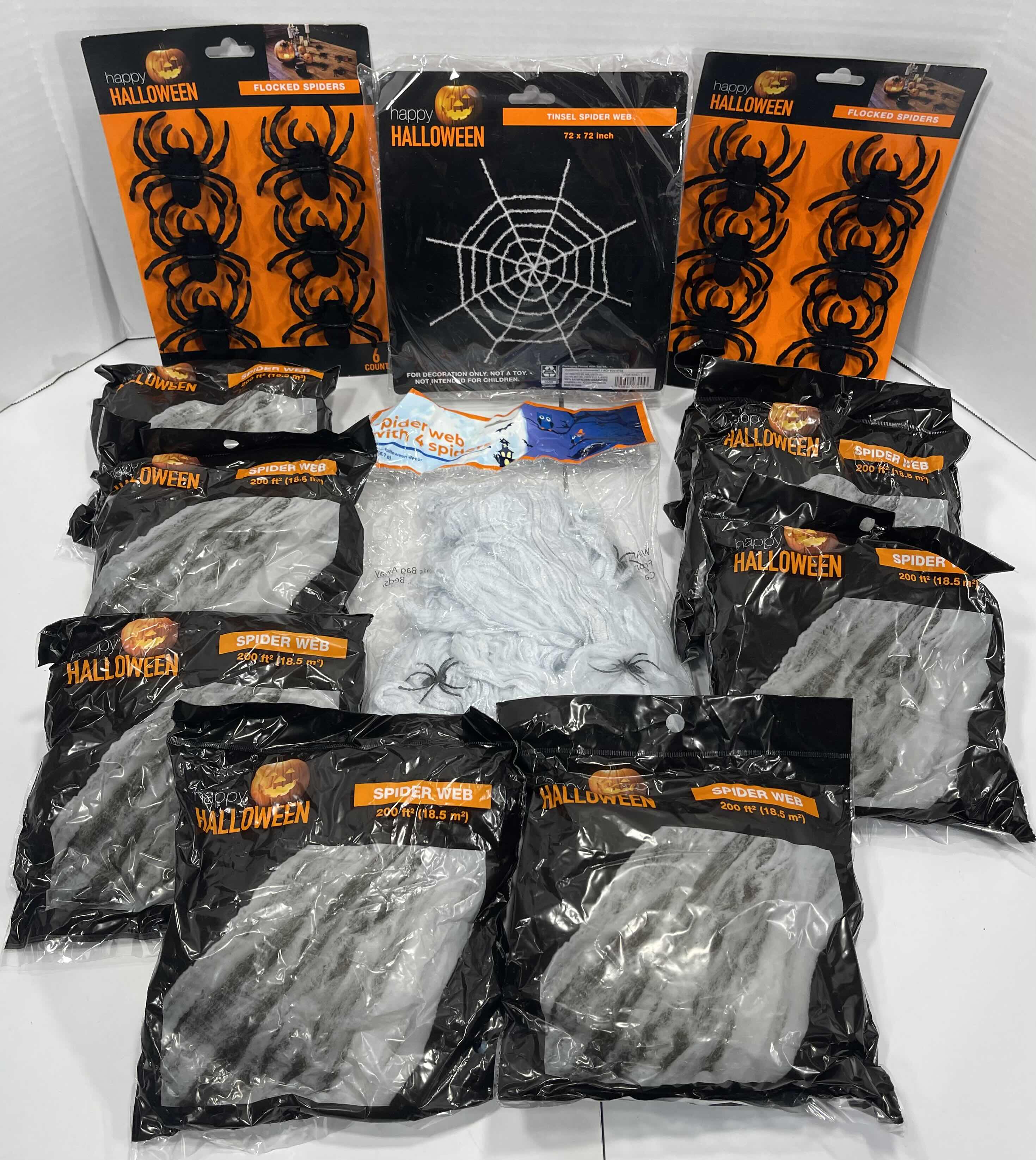 Photo 1 of SPIDER WEB LOT (9 BAGS), TINSEL SPIDER WEB 72” X 72” & FLOCKED SPIDERS (12 COUNT)
