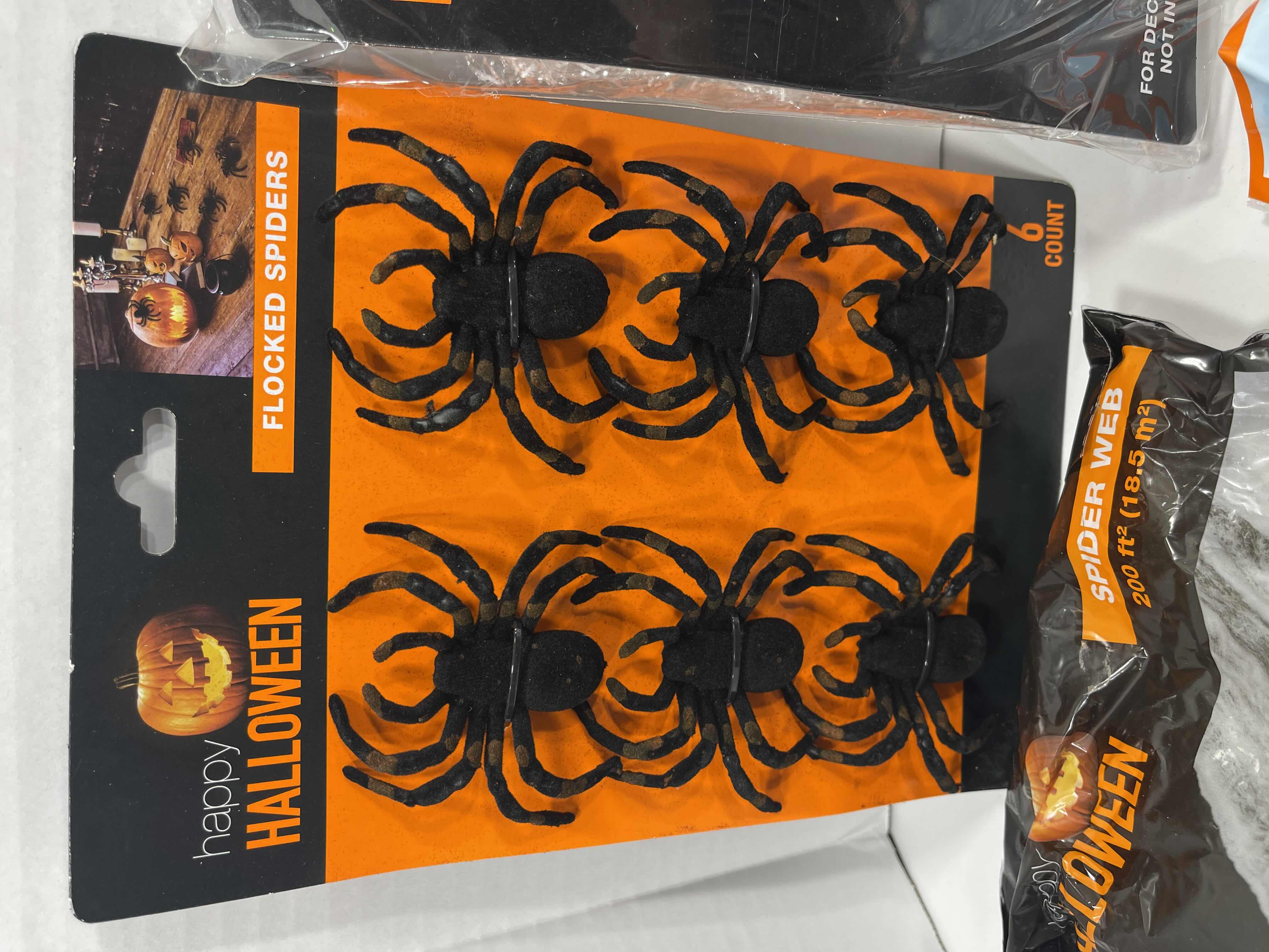 Photo 1 of SPIDER WEB LOT (9 BAGS), TINSEL SPIDER WEB 72” X 72” & FLOCKED SPIDERS (12 COUNT)