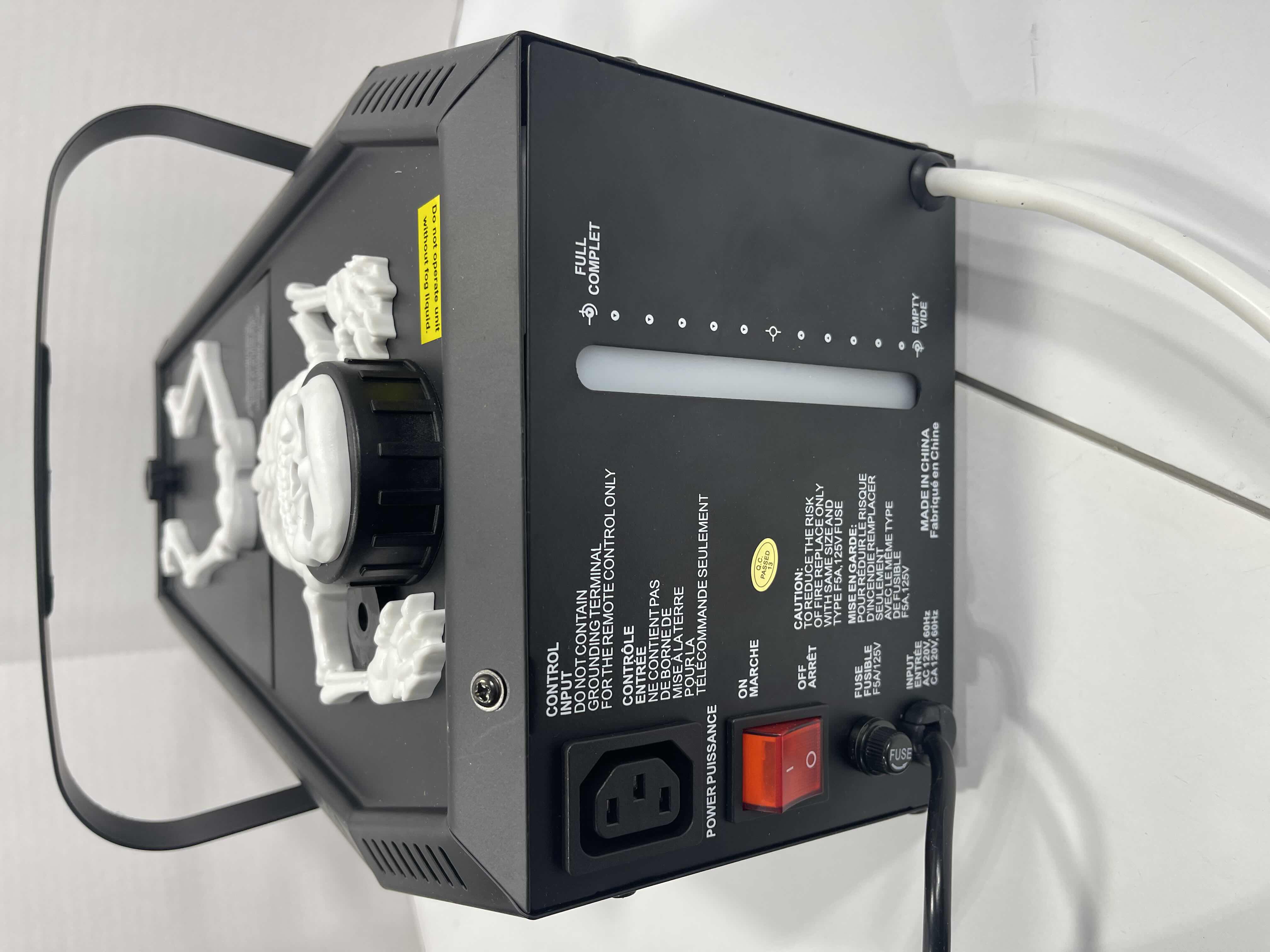 Photo 1 of HOME ACCENTS SKELETON CASKET GROUND FOGGER 400 WATT