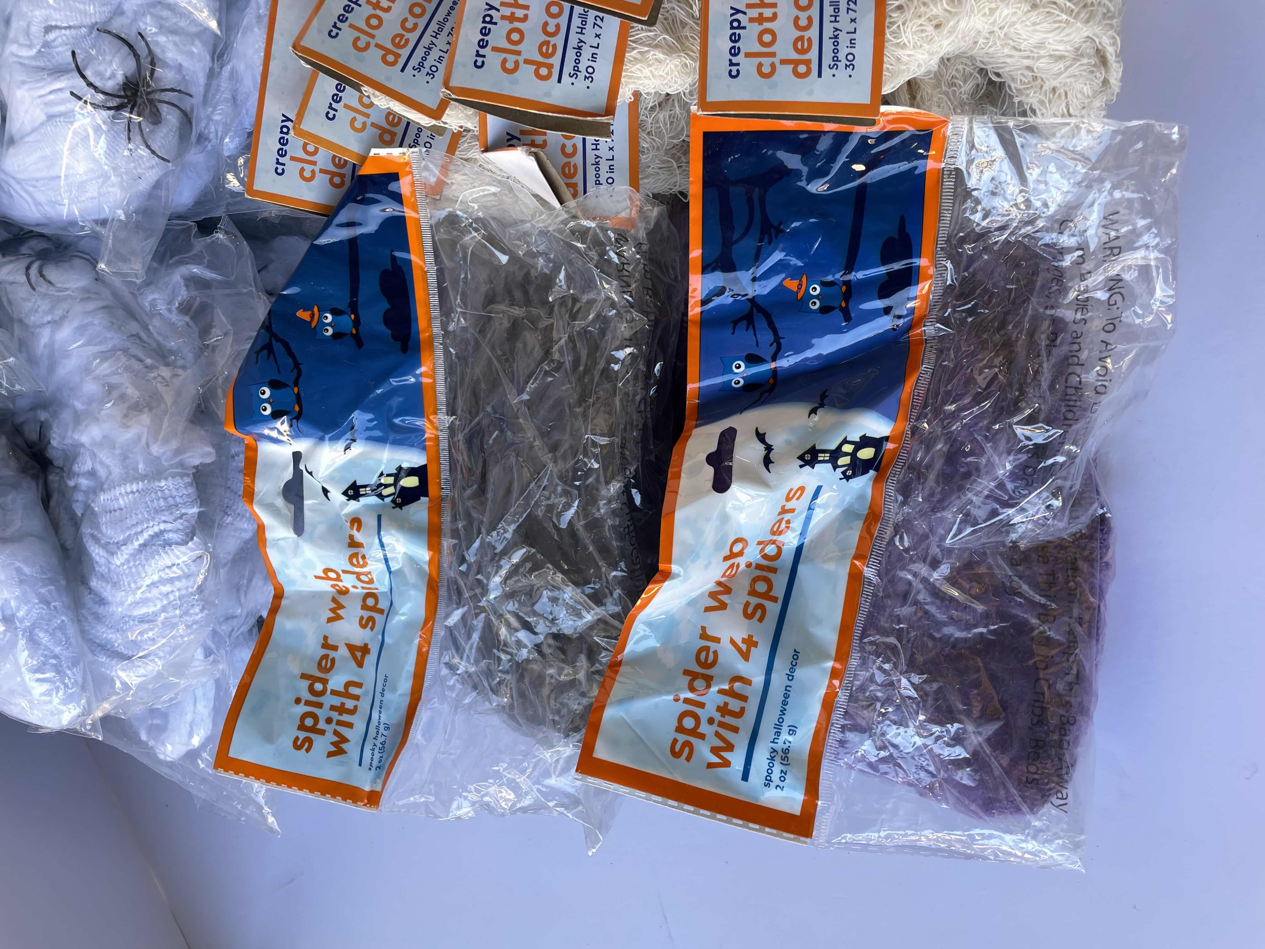 Photo 1 of HALLOWEEN SPIDER WEBS AND CREEPY CLOTHS DECOR LOT (33 ITEMS) MSRP $99