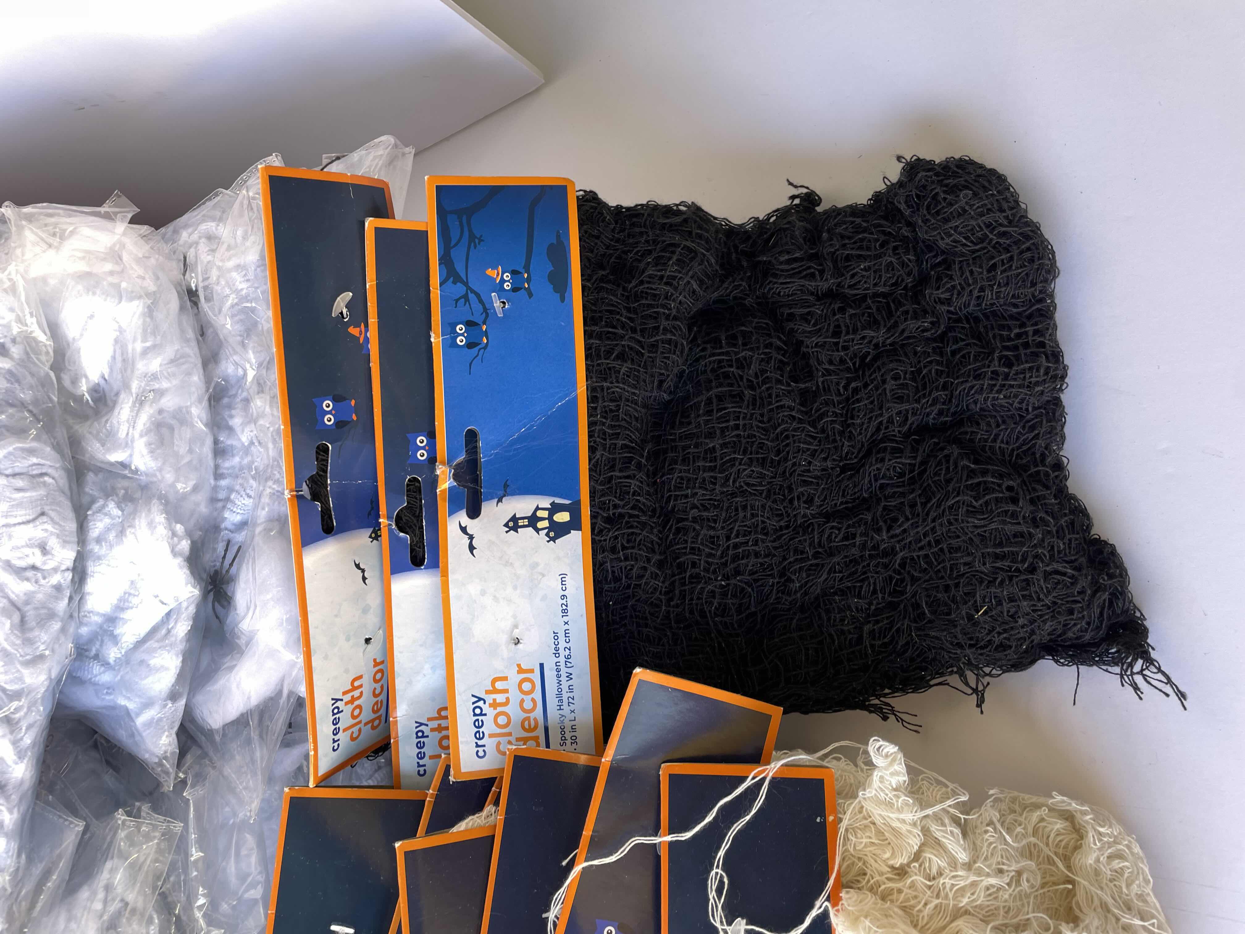 Photo 1 of HALLOWEEN SPIDER WEBS AND CREEPY CLOTHS DECOR LOT (33 ITEMS) MSRP $99