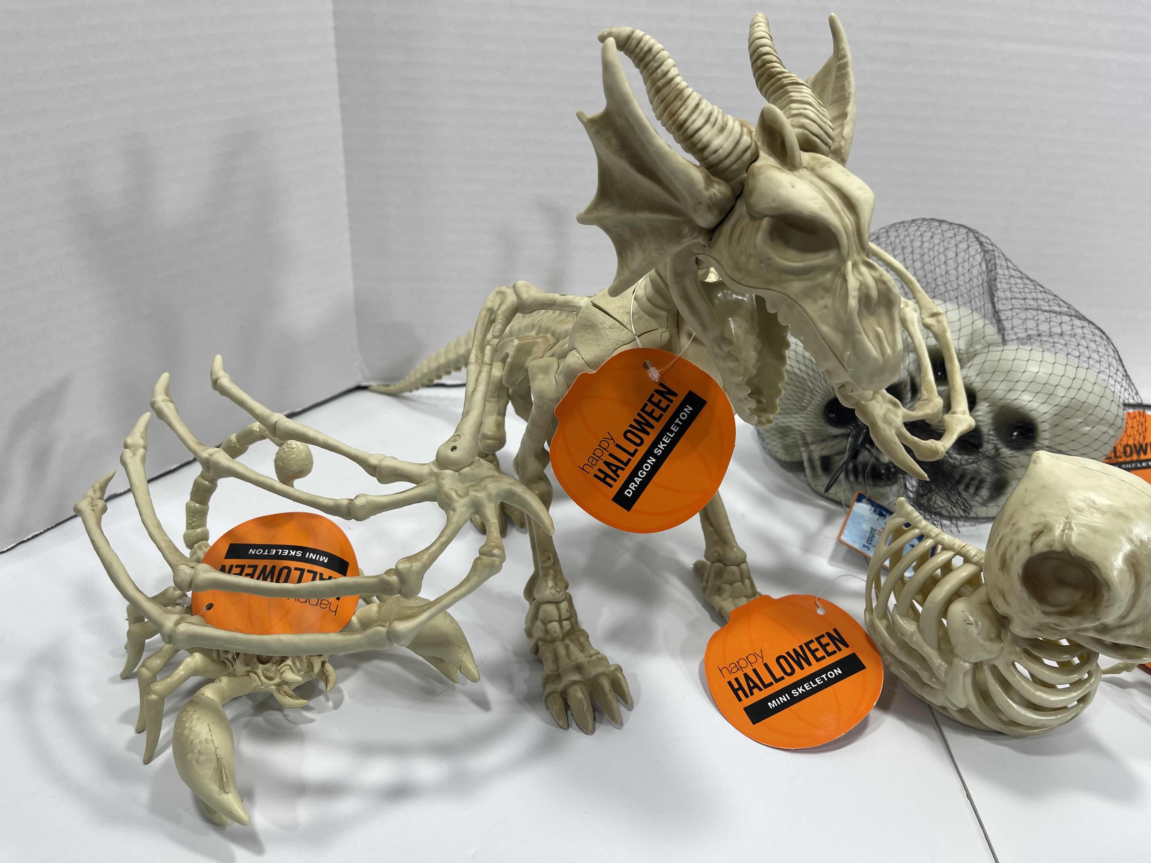 Photo 1 of HALLOWEEN DRAGON SKELETON, MINI SKELETONS & SKULLS YARD/HOME DECORATIONS - (7 ITEMS) MSRP $80