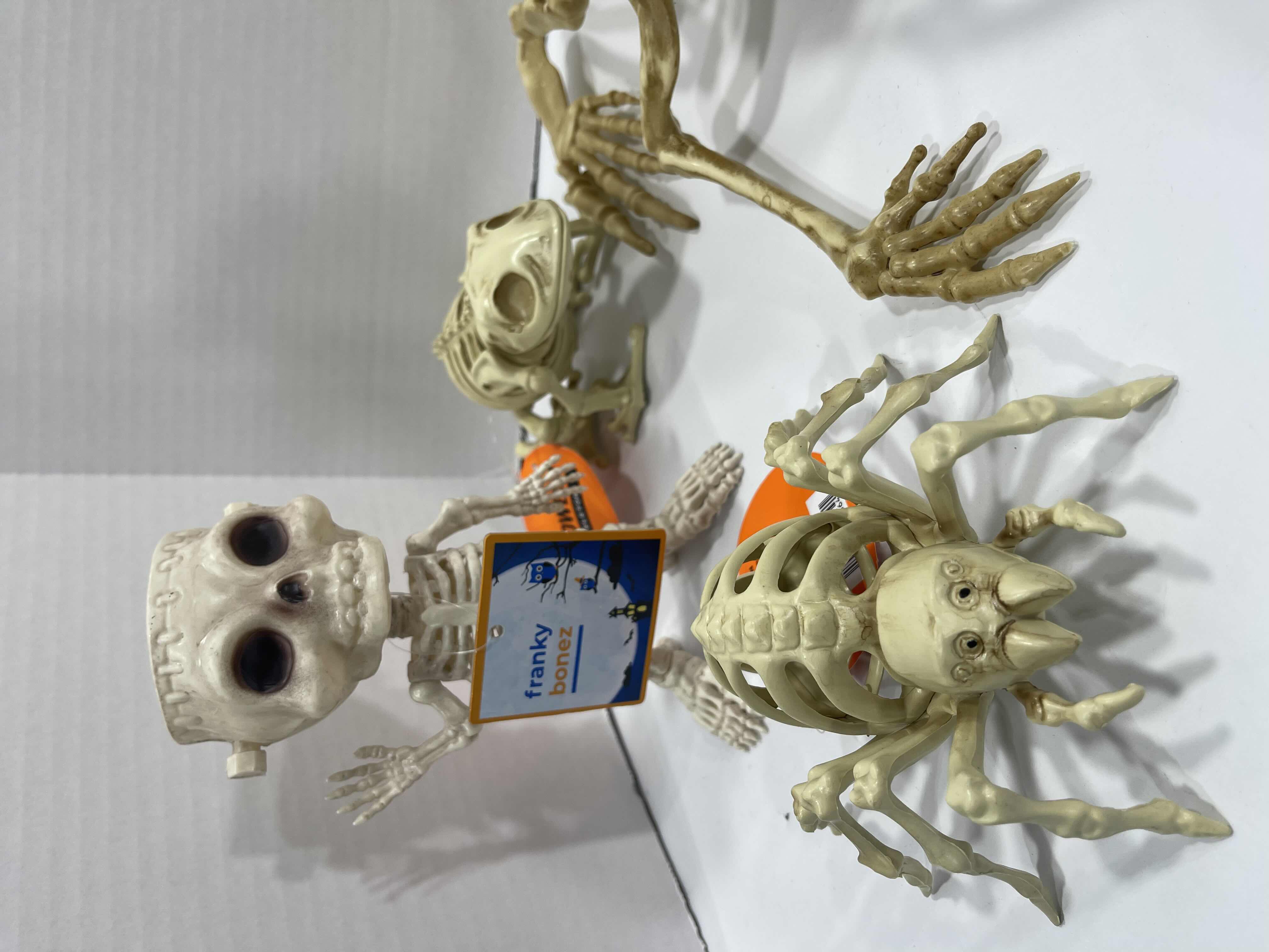 Photo 1 of HALLOWEEN FROG SKELETON LIGHT-UP, BAT SKELETON, MINI SKELETONS YARD/HOME DECORATIONS (7 ITEMS) MSRP $80