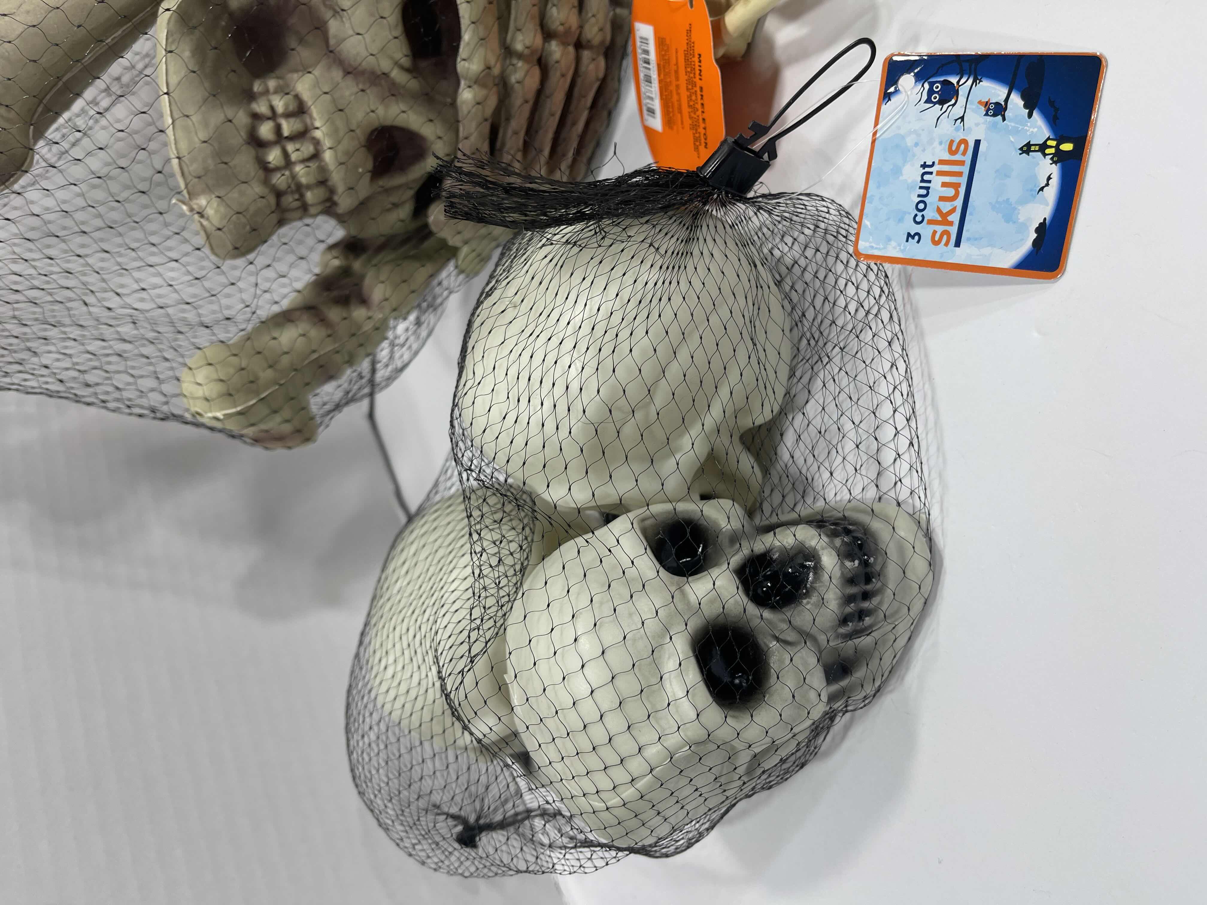 Photo 1 of HALLOWEEN RAT SKELETON LIGHT-UP, 12PCS BAG OF BONES, MINI SKELETONS & SKUKLS YARD/HOME DECORATIONS (7 ITEMS) MSRP $90