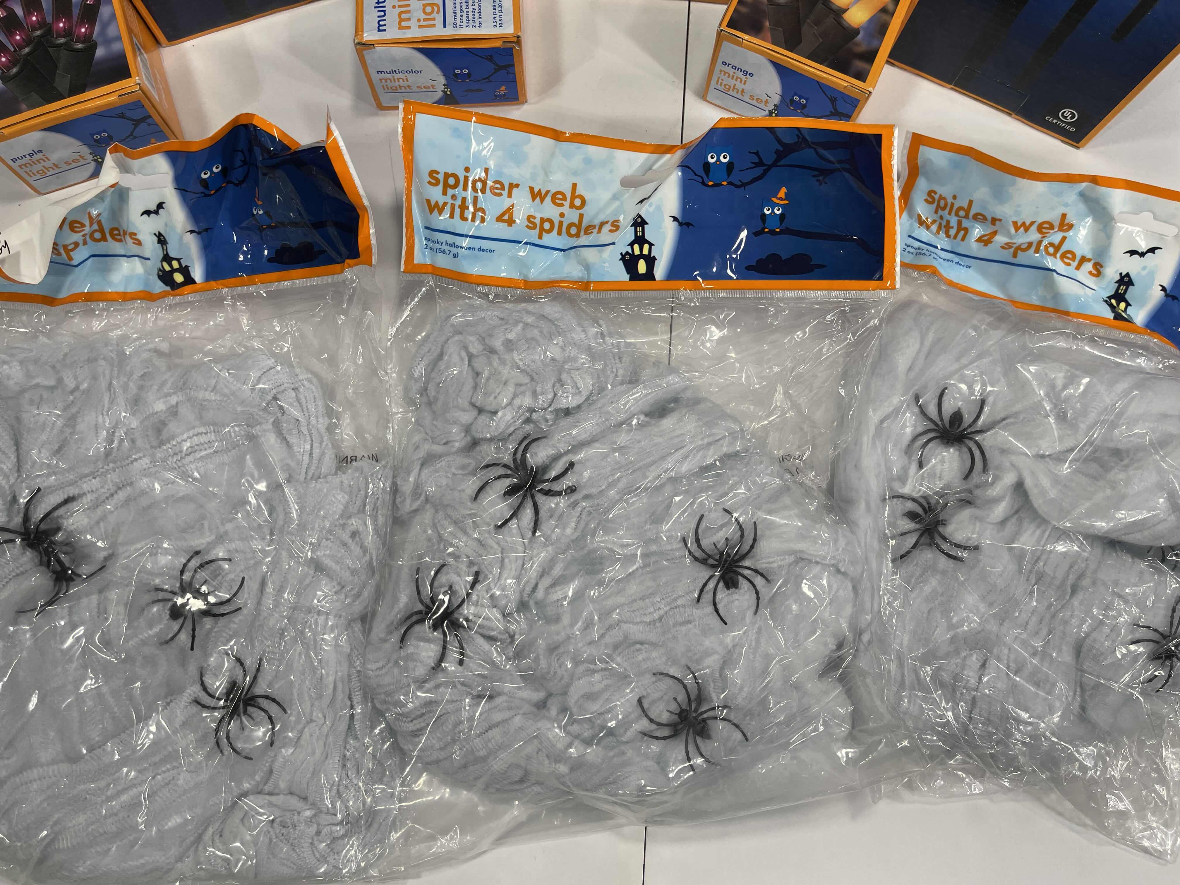 Photo 1 of HALLOWEEN INDOOR/OUTDOOR LIGHT SETS (6), CANDY CORN LIGHT SET (2), LIGHTED LAWN STAKES (3) & SPIDER WEBS WITH SPIDERS (3 BAGS) MSRP $75