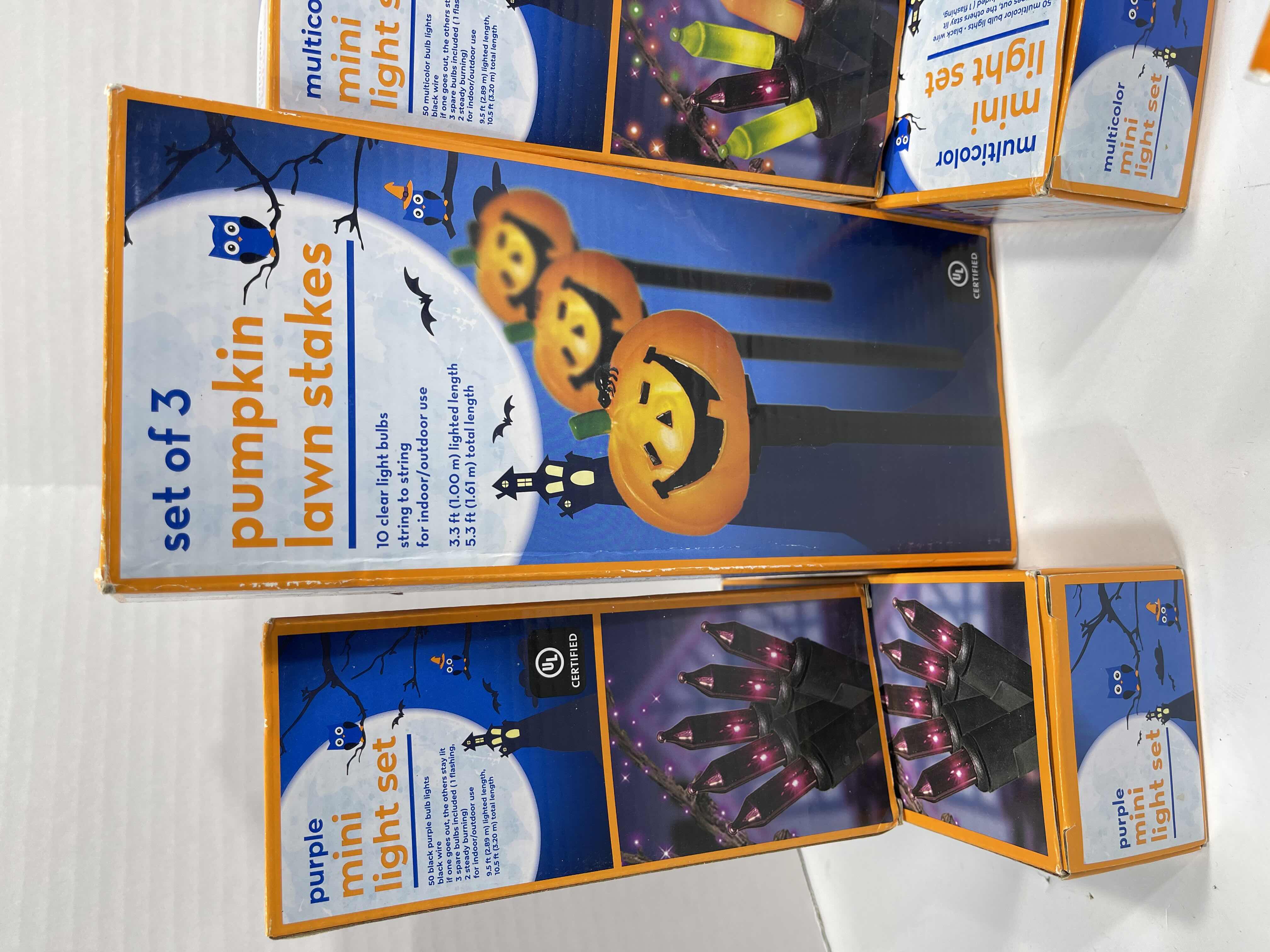 Photo 1 of HALLOWEEN INDOOR/OUTDOOR LIGHT SETS (6), CANDY CORN LIGHT SET (2), LIGHTED LAWN STAKES (3) & SPIDER WEBS WITH SPIDERS (3 BAGS) MSRP $75