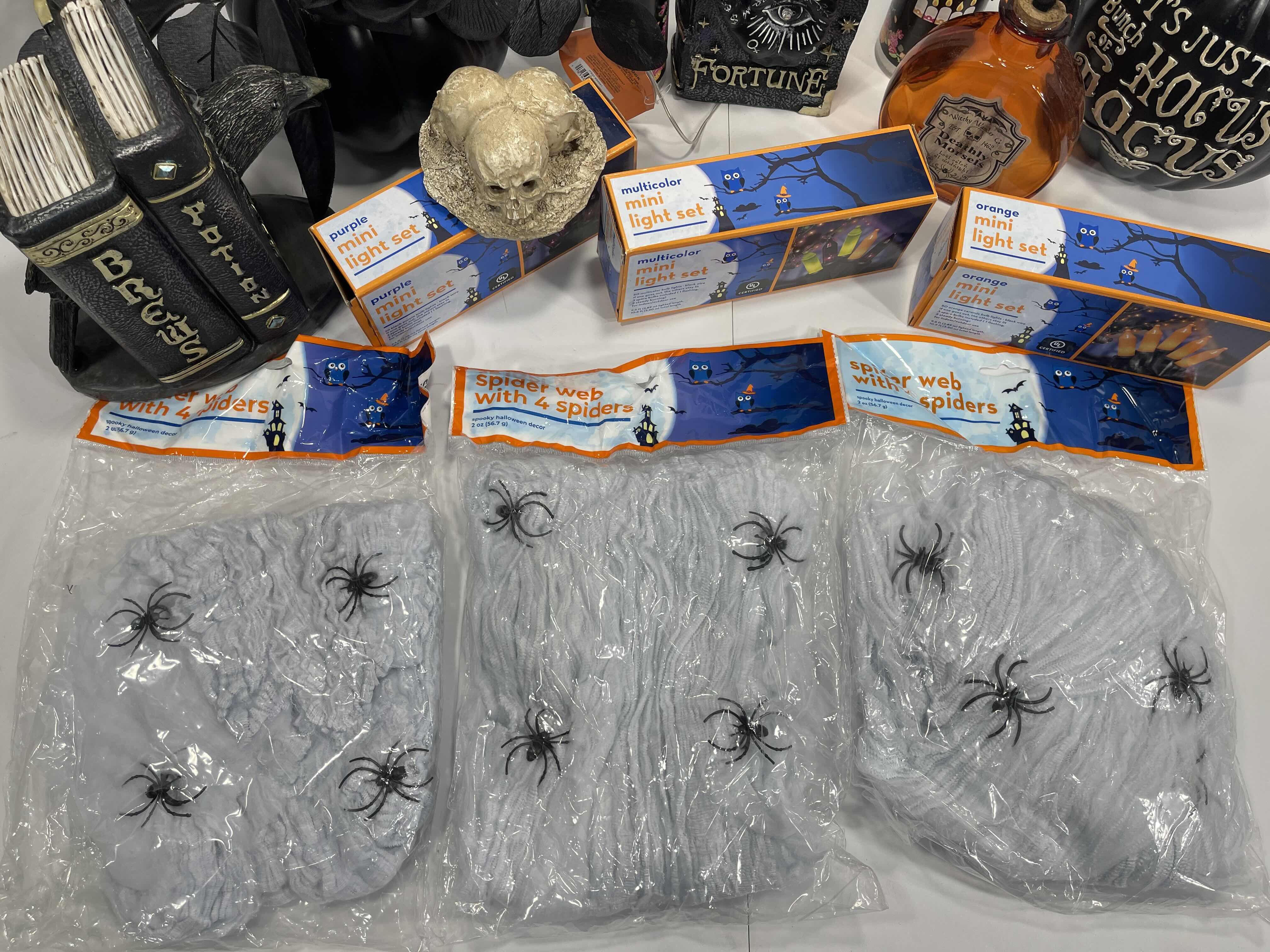 Photo 1 of HALLOWEEN HOME TABLE TOP DECOR (14 ITEMS) -  SPIDER WEBS, LIGHT SETS, CANDLES, RESIN DECOR ETC MSRP $100