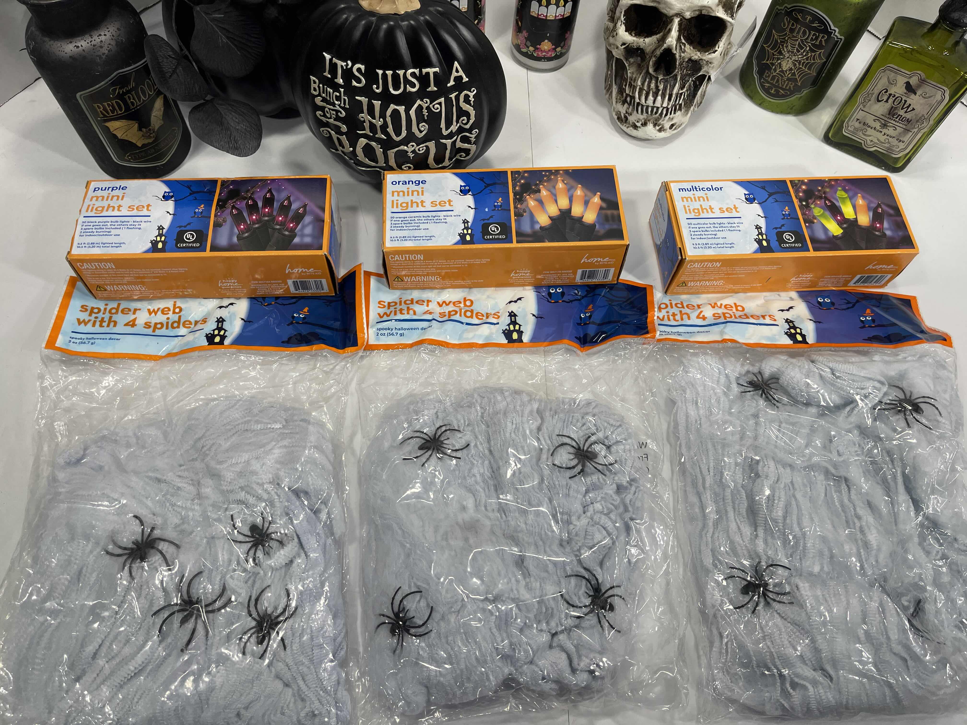 Photo 1 of HALLOWEEN HOME TABLE TOP DECOR (14 ITEMS) -  SPIDER WEBS, LIGHT SETS, CANDLES, RESIN DECOR ETC MSRP $100