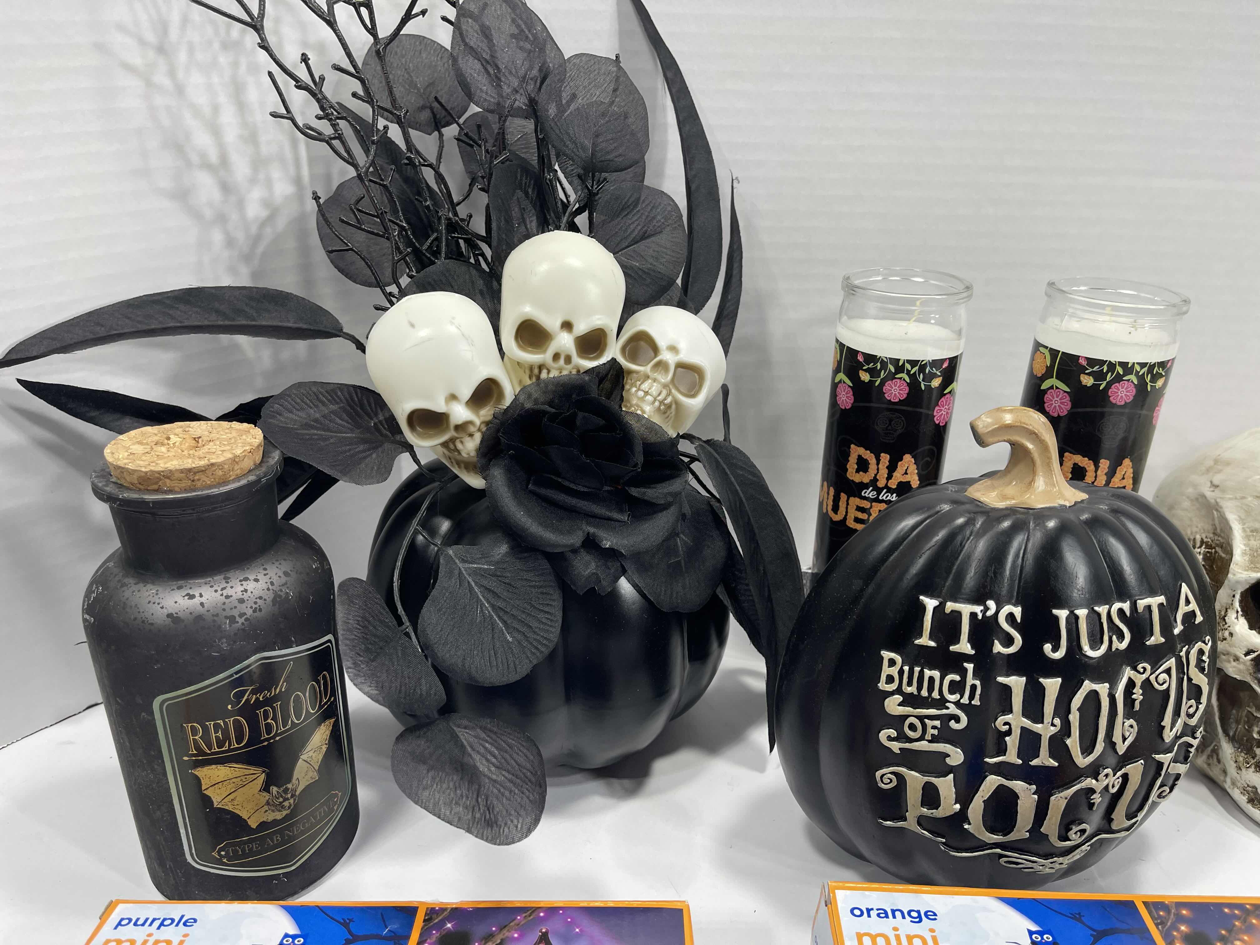 Photo 1 of HALLOWEEN HOME TABLE TOP DECOR (14 ITEMS) -  SPIDER WEBS, LIGHT SETS, CANDLES, RESIN DECOR ETC MSRP $100