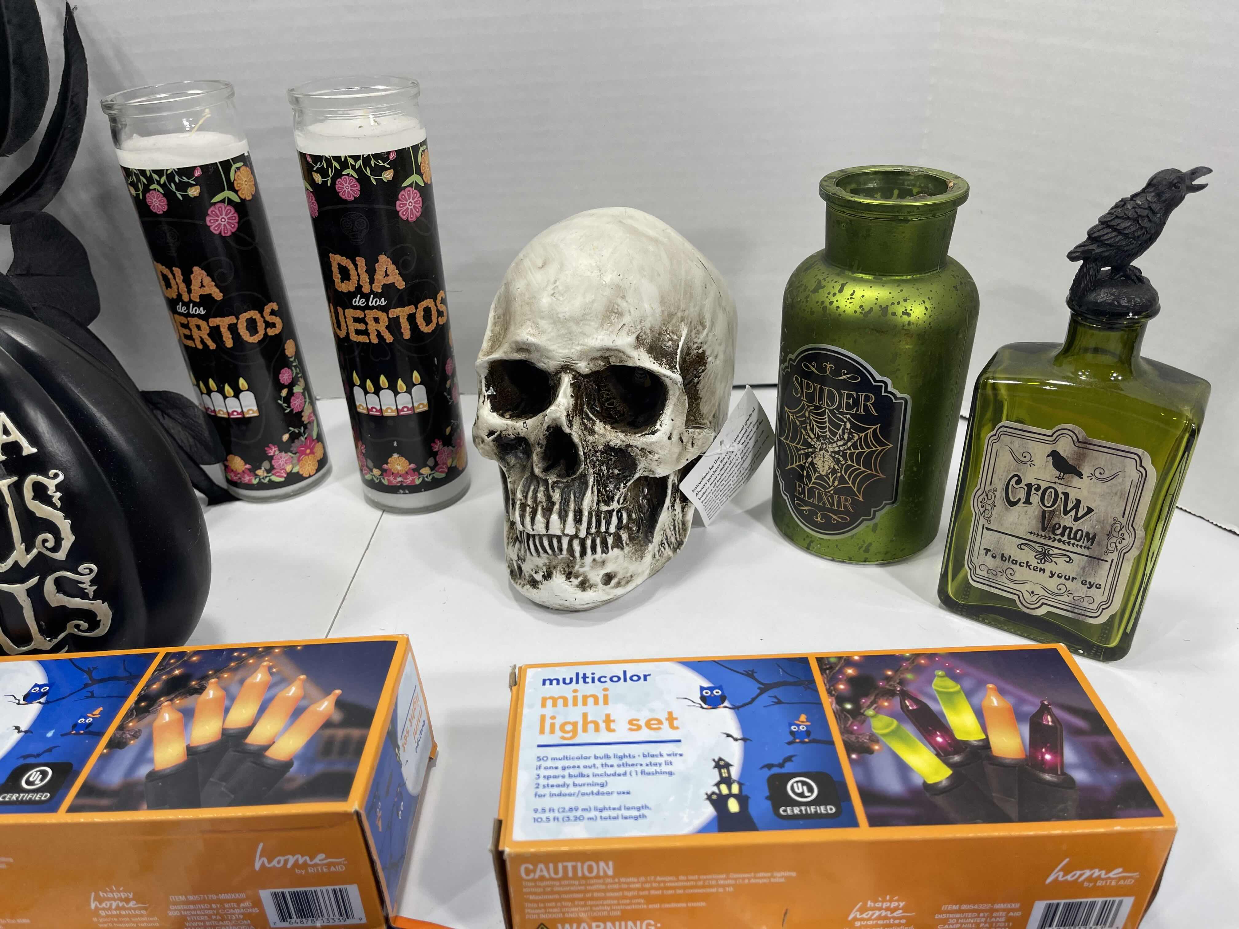 Photo 1 of HALLOWEEN HOME TABLE TOP DECOR (14 ITEMS) -  SPIDER WEBS, LIGHT SETS, CANDLES, RESIN DECOR ETC MSRP $100