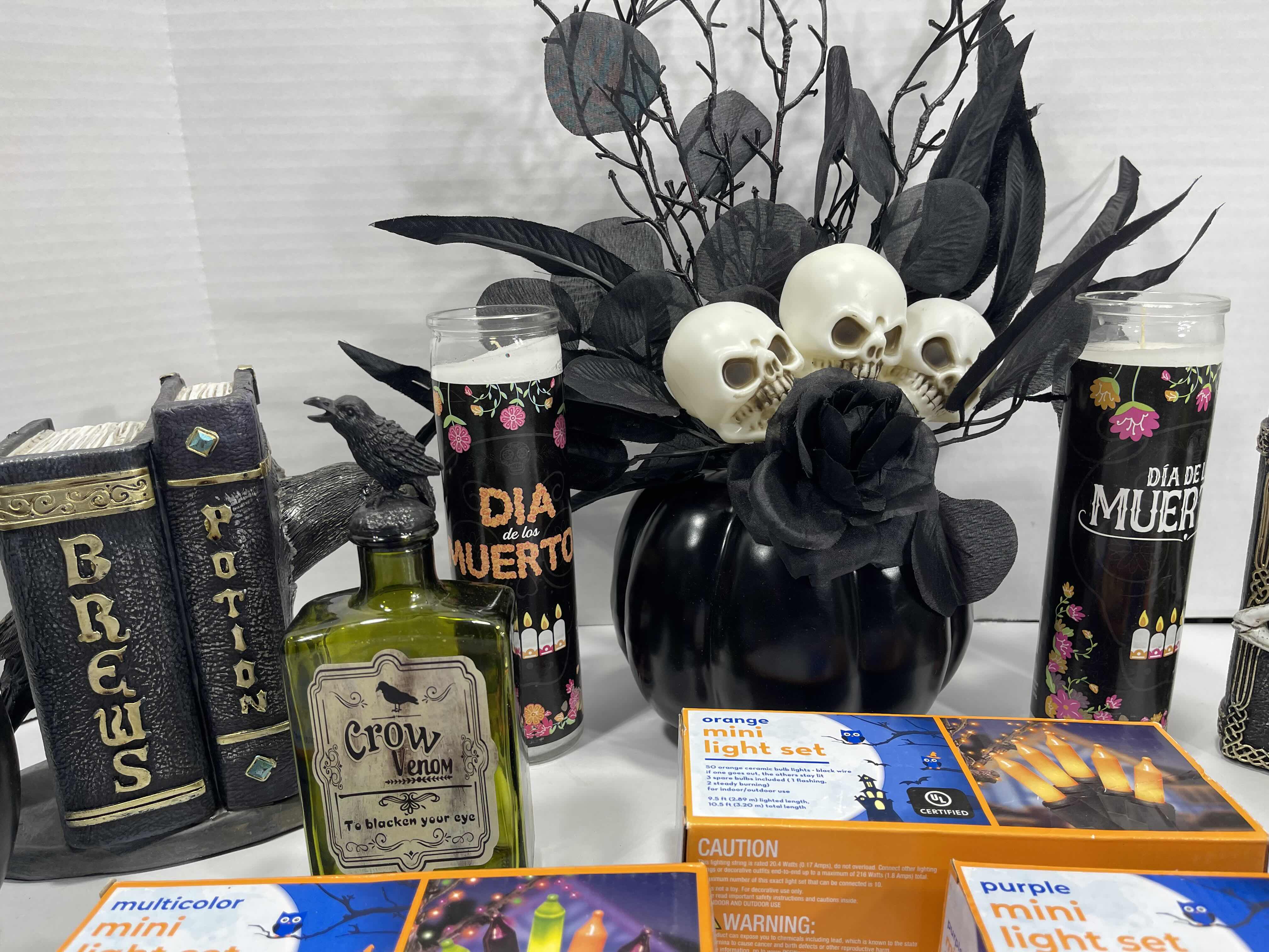Photo 1 of HALLOWEEN HOME TABLE TOP DECOR (14 ITEMS) -  SPIDER WEBS, LIGHT SETS, CANDLES, RESIN DECOR ETC MSRP $100