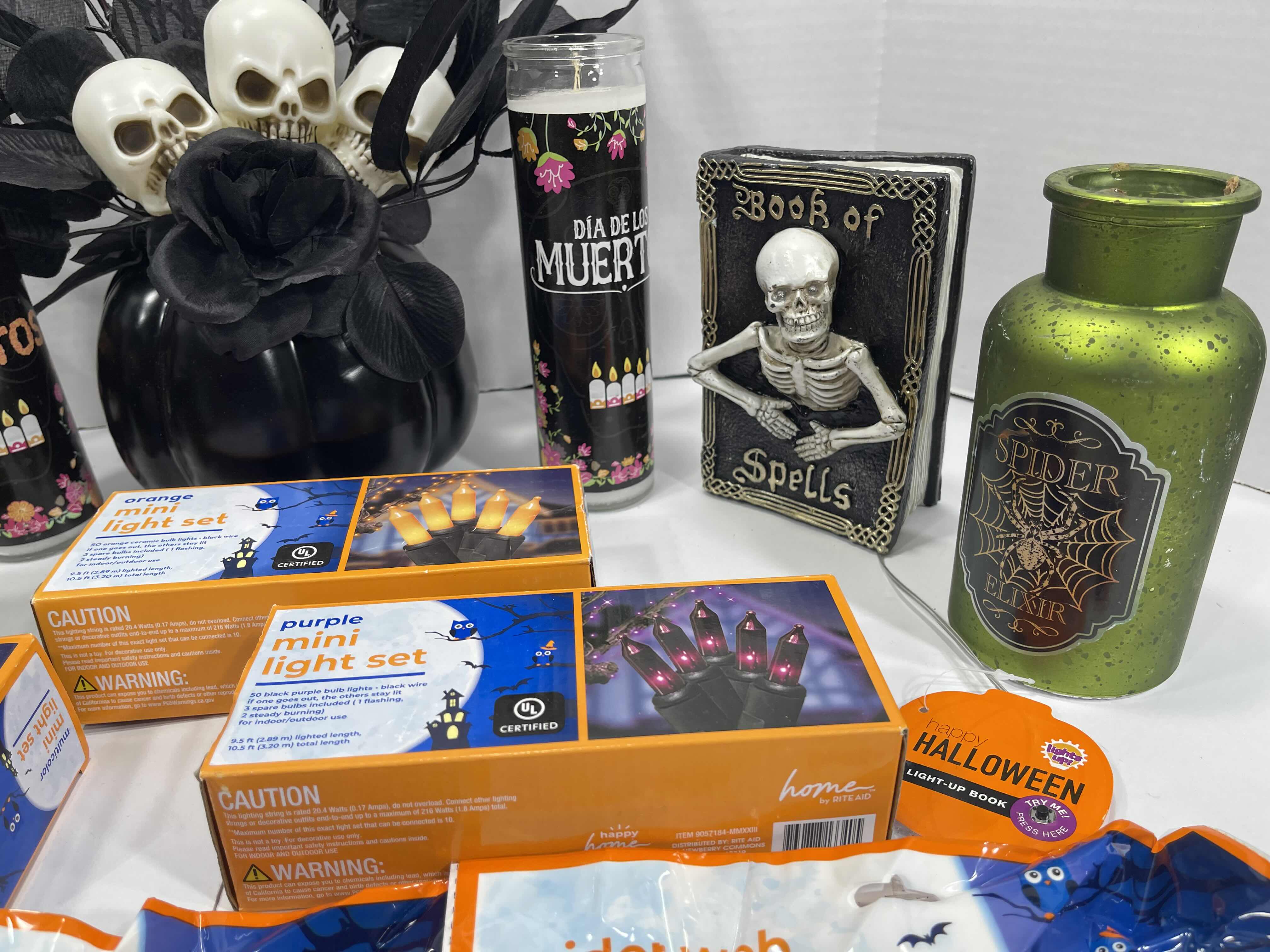 Photo 1 of HALLOWEEN HOME TABLE TOP DECOR (14 ITEMS) -  SPIDER WEBS, LIGHT SETS, CANDLES, RESIN DECOR ETC MSRP $100