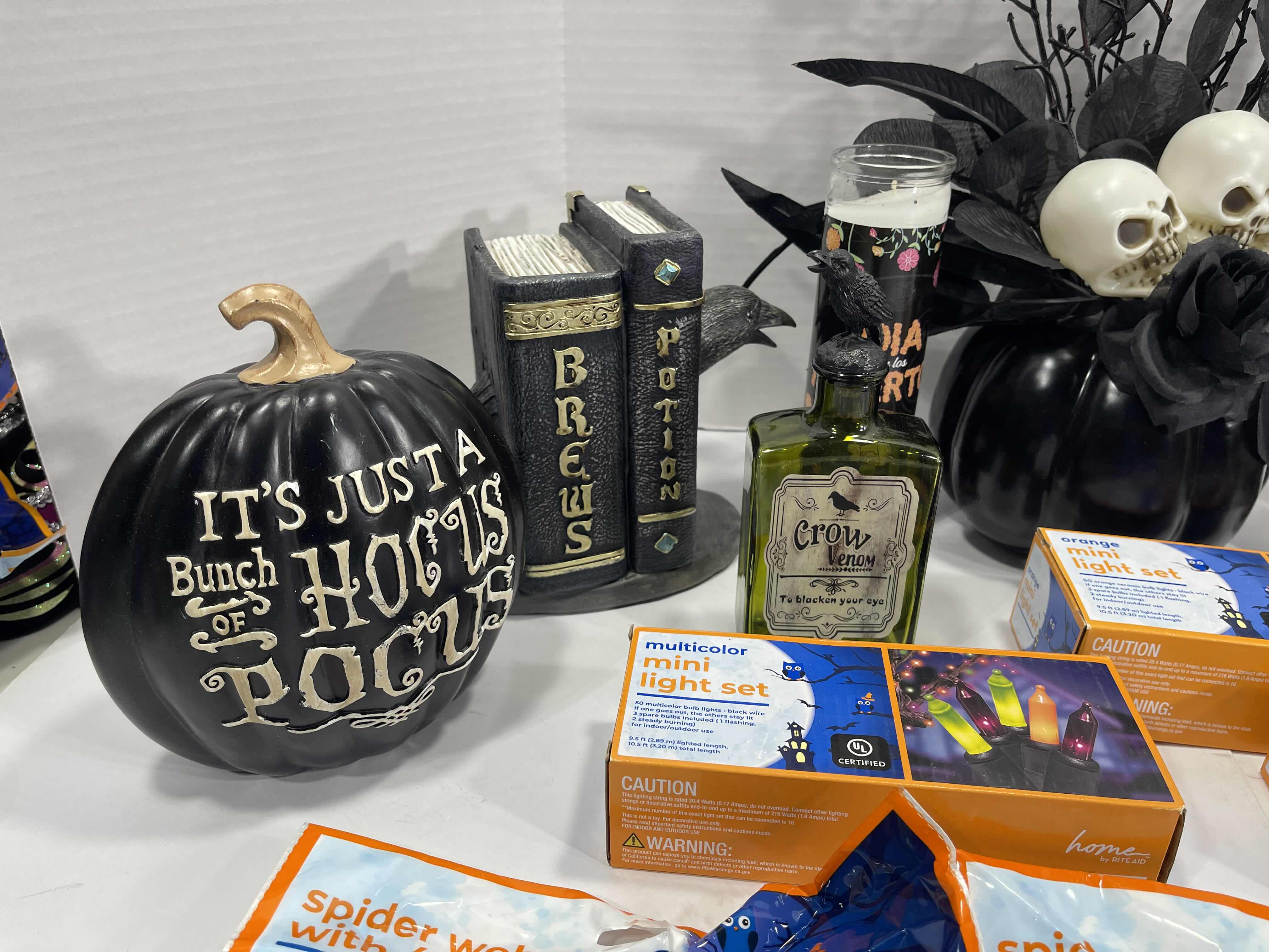 Photo 1 of HALLOWEEN HOME TABLE TOP DECOR (14 ITEMS) -  SPIDER WEBS, LIGHT SETS, CANDLES, RESIN DECOR ETC MSRP $100
