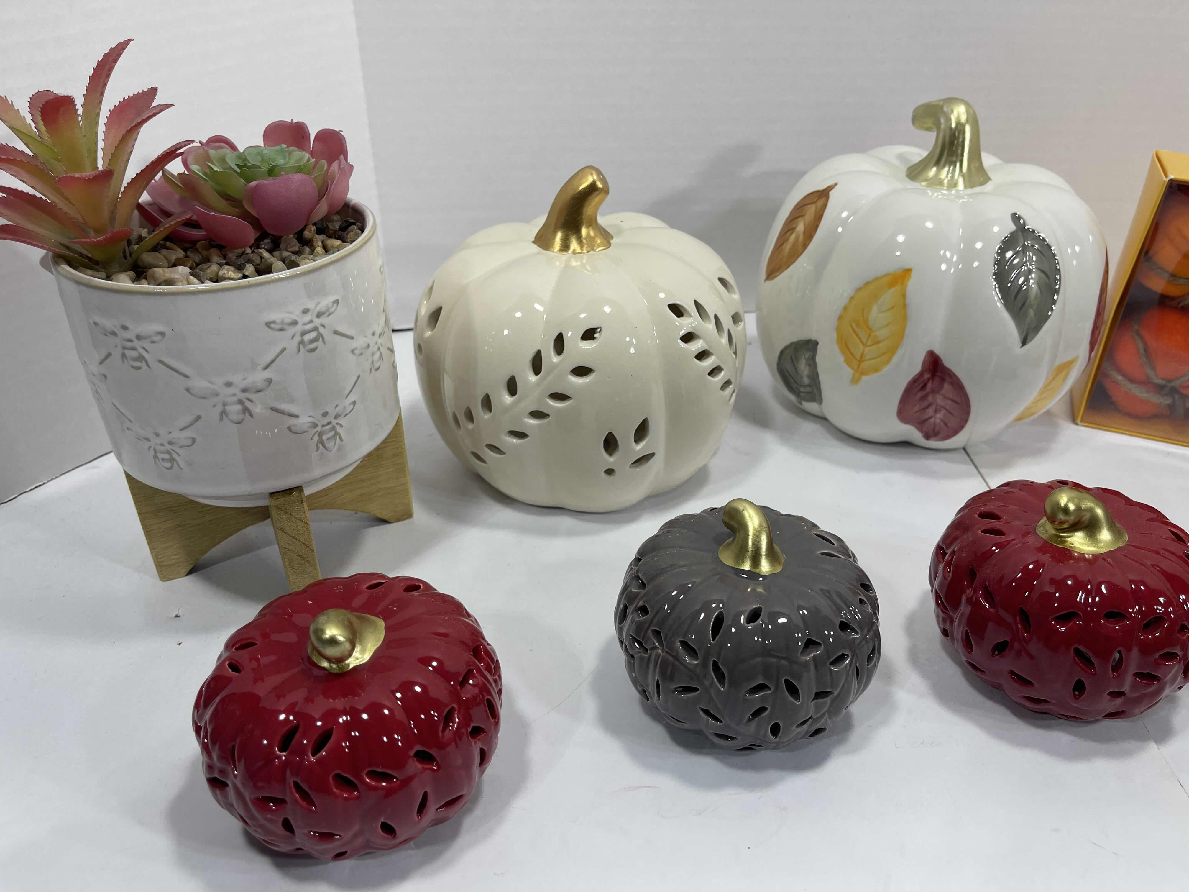 Photo 1 of HOLIDAY CERAMIC PUMPKINS (6) TALLEST 6.5”, GARDEN PARTY FAUX PLANT H8” & AUTUMN FALL HOME DECOR - PUMPKIN GARLAND AND CHEESE KNIFE SET MSRP $90