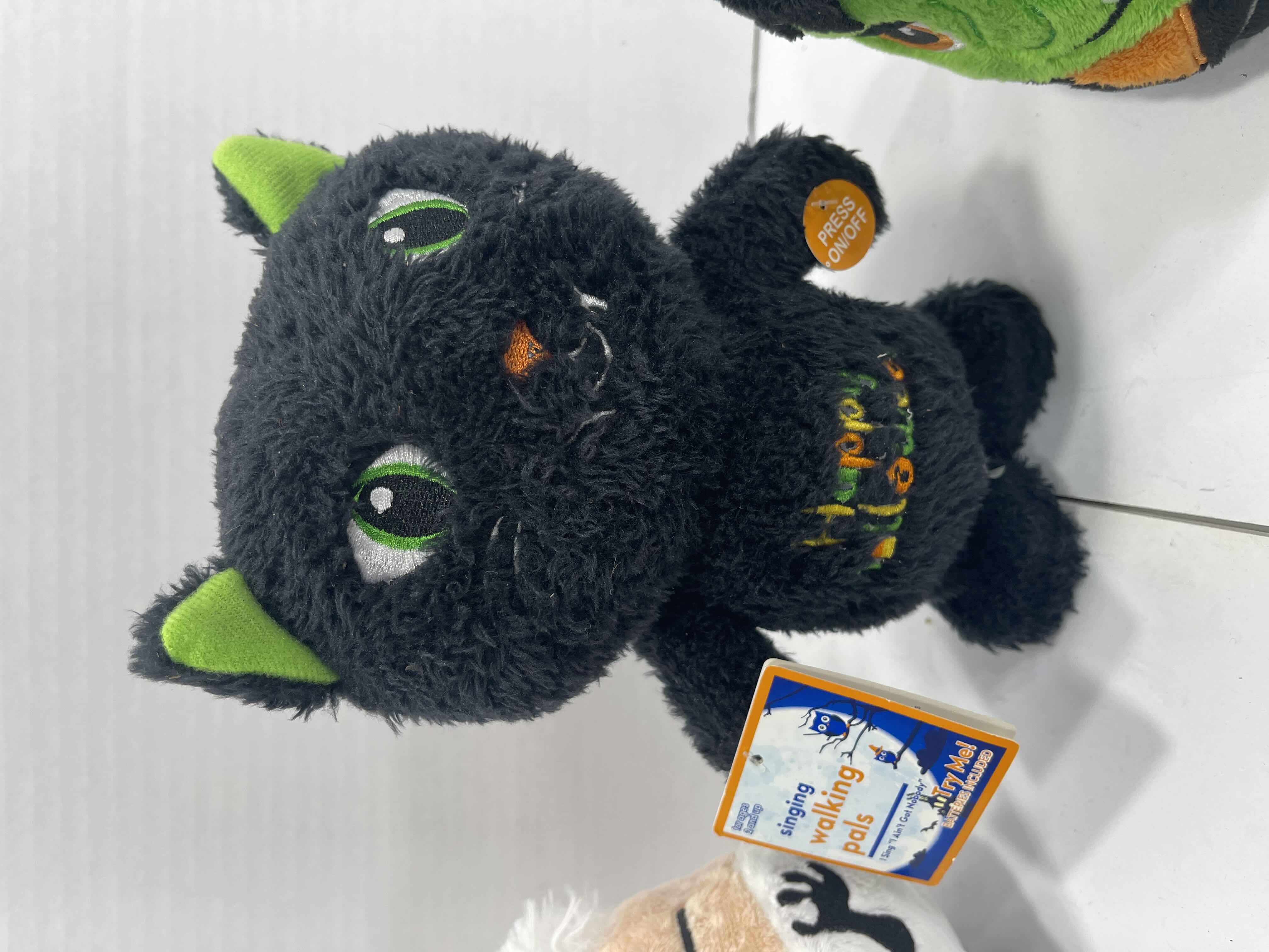 Photo 1 of HALLOWEEN SINGING WALKING PLUSH H8.5” & FRANKENSTEIN/SCIENTIST REVERSIBLE PLUSH H5” (2) MSRP $40