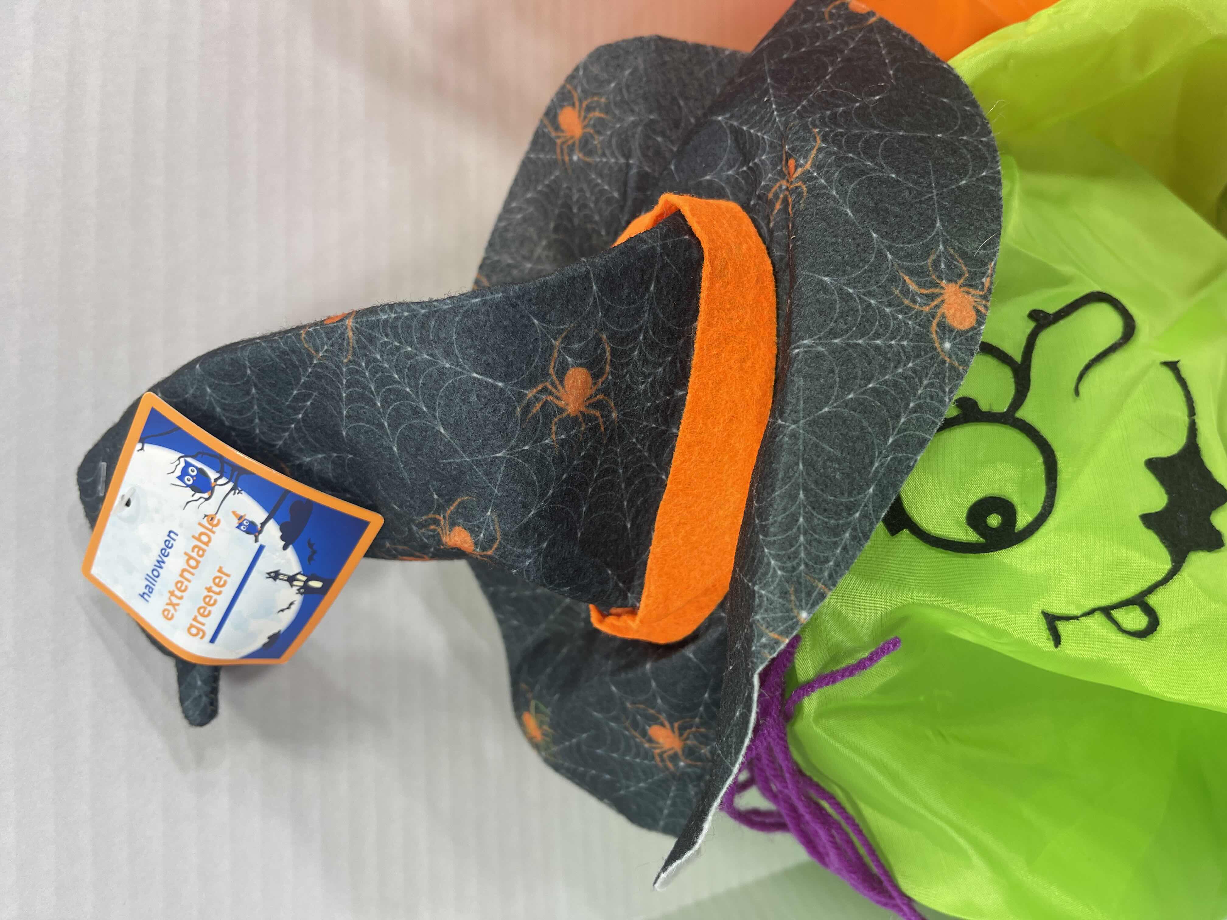 Photo 1 of HALLOWEEN EXTENDABLE GREETERS (2) - PUMPKIN (EXTENDED H28”) & WITCH (EXTENDED H30”) MSRP $50