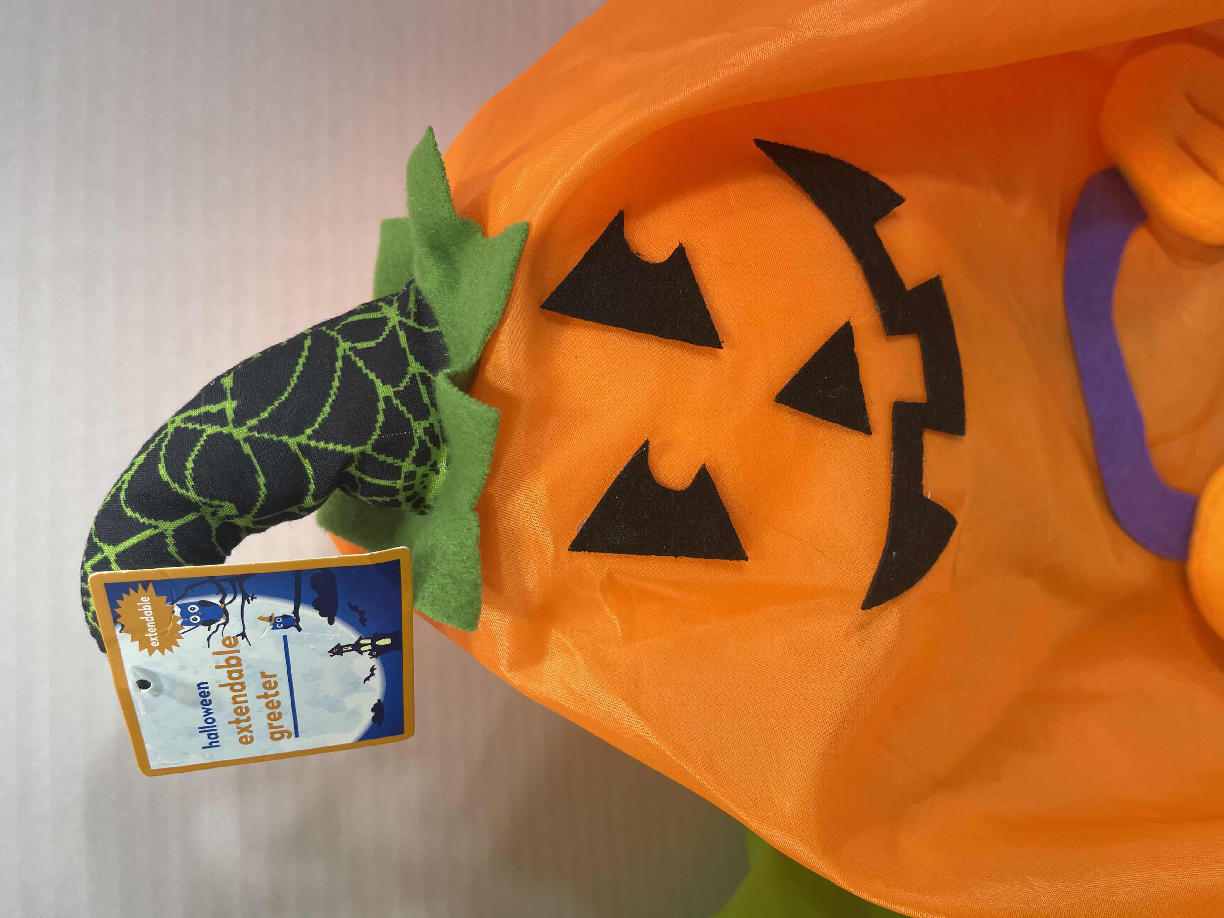 Photo 1 of HALLOWEEN EXTENDABLE GREETERS (2) - PUMPKIN (EXTENDED H28”) & WITCH (EXTENDED H30”) MSRP $50