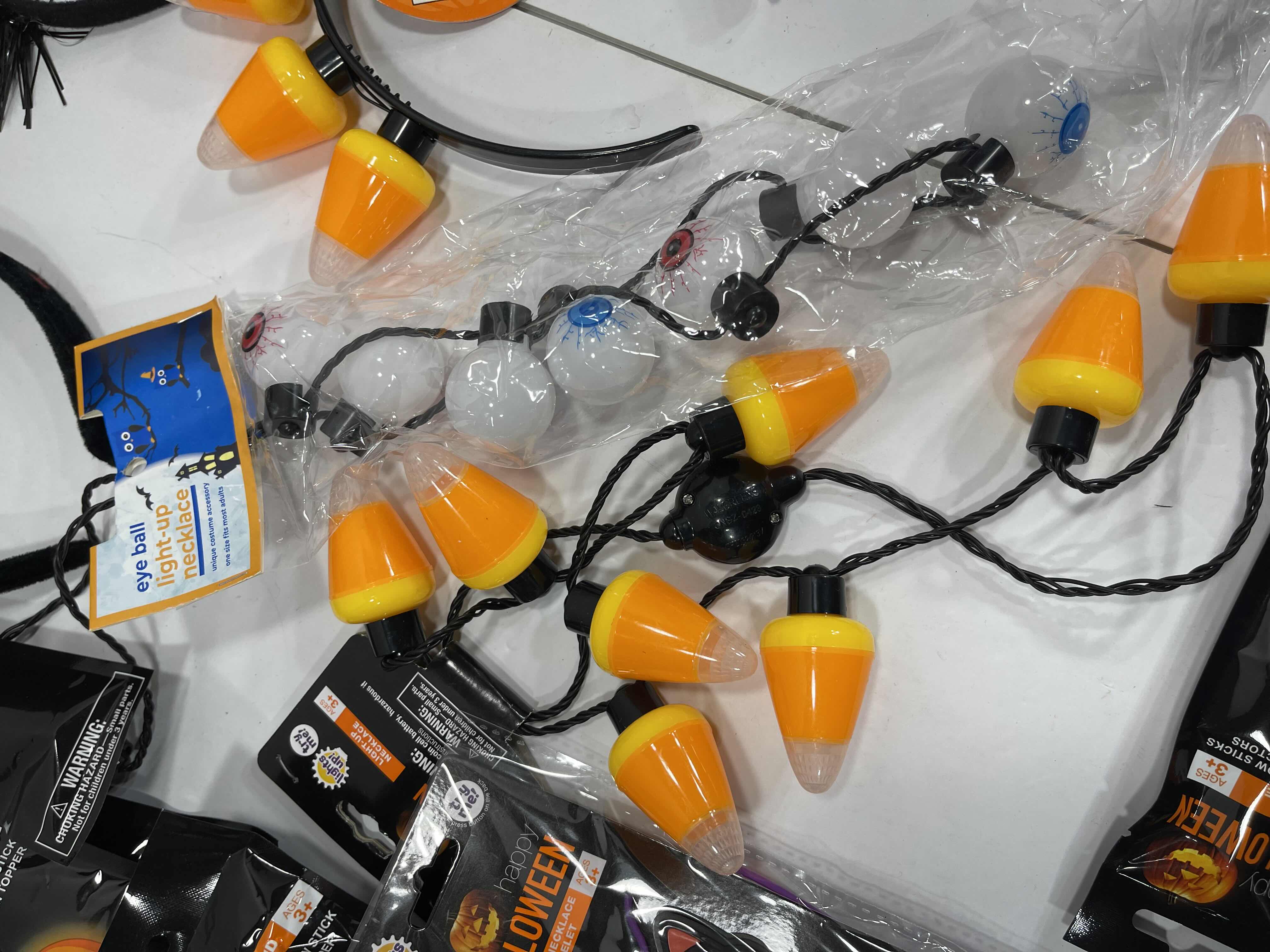 Photo 1 of HALLOWEEN LIGHT-UPS LOT (18 ITEMS) - HEADBANDS, NECKLACES, BRACELETS & GLOW WANDS MSRP $50