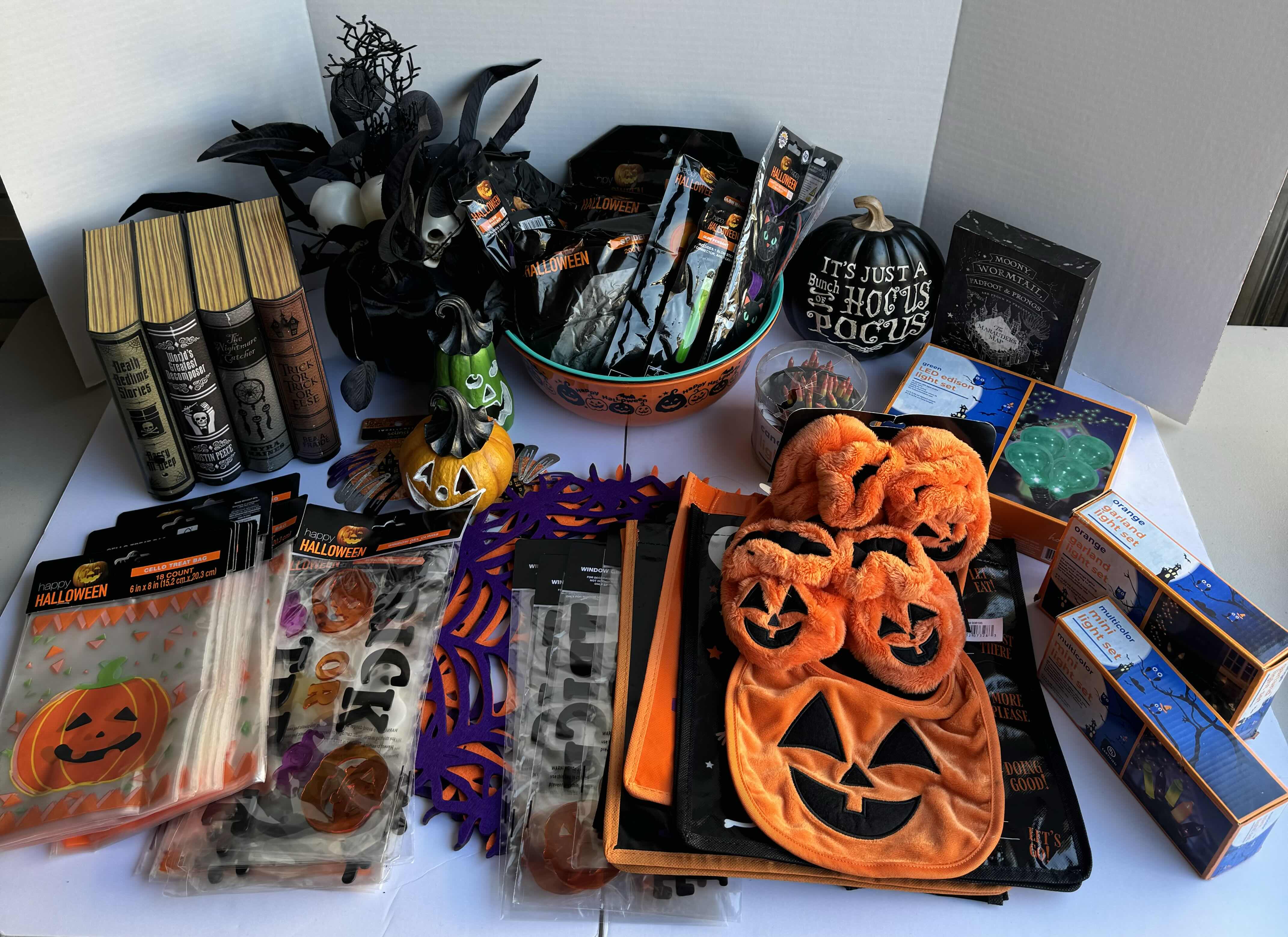 Photo 1 of HALLOWEEN TABLE TOP DECOR LARGE ASSORTMENT - CANDY BOWLS, LIGHT SETS, GLOW STICKS, ANIMATED BOOK DISPLAY, WOOD DISPLAYS, CERAMIC PUMPKINS AND MORE MSRP $70