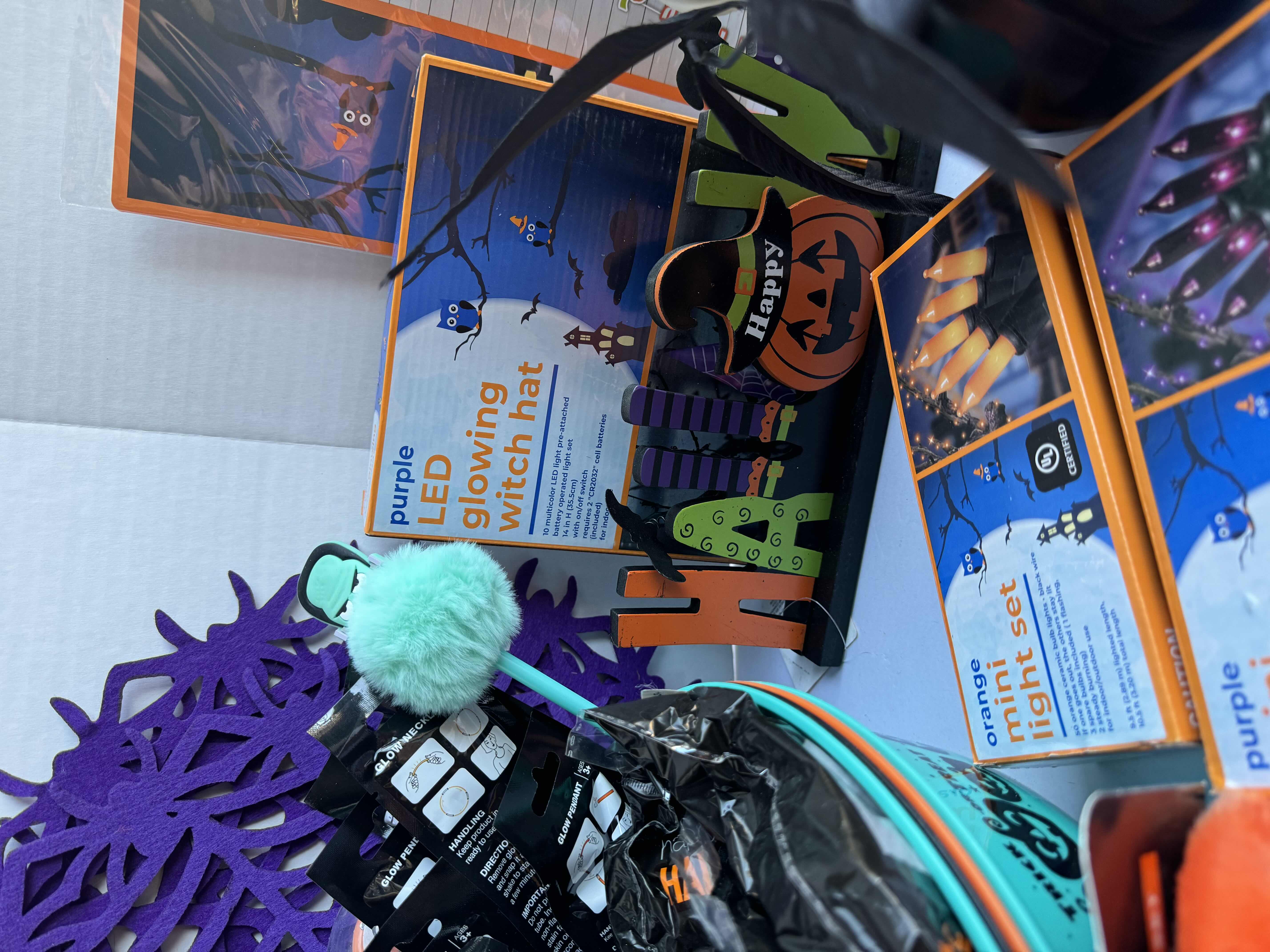 Photo 1 of HALLOWEEN TABLE TOP DECOR LARGE ASSORTMENT - CANDY BOWLS, LIGHT SETS, GLOW STICKS, HALLOWEEN CUPS, WOOD DISPLAYS, RESIN PUMPKINS, TOYS AND MORE MSRP $70