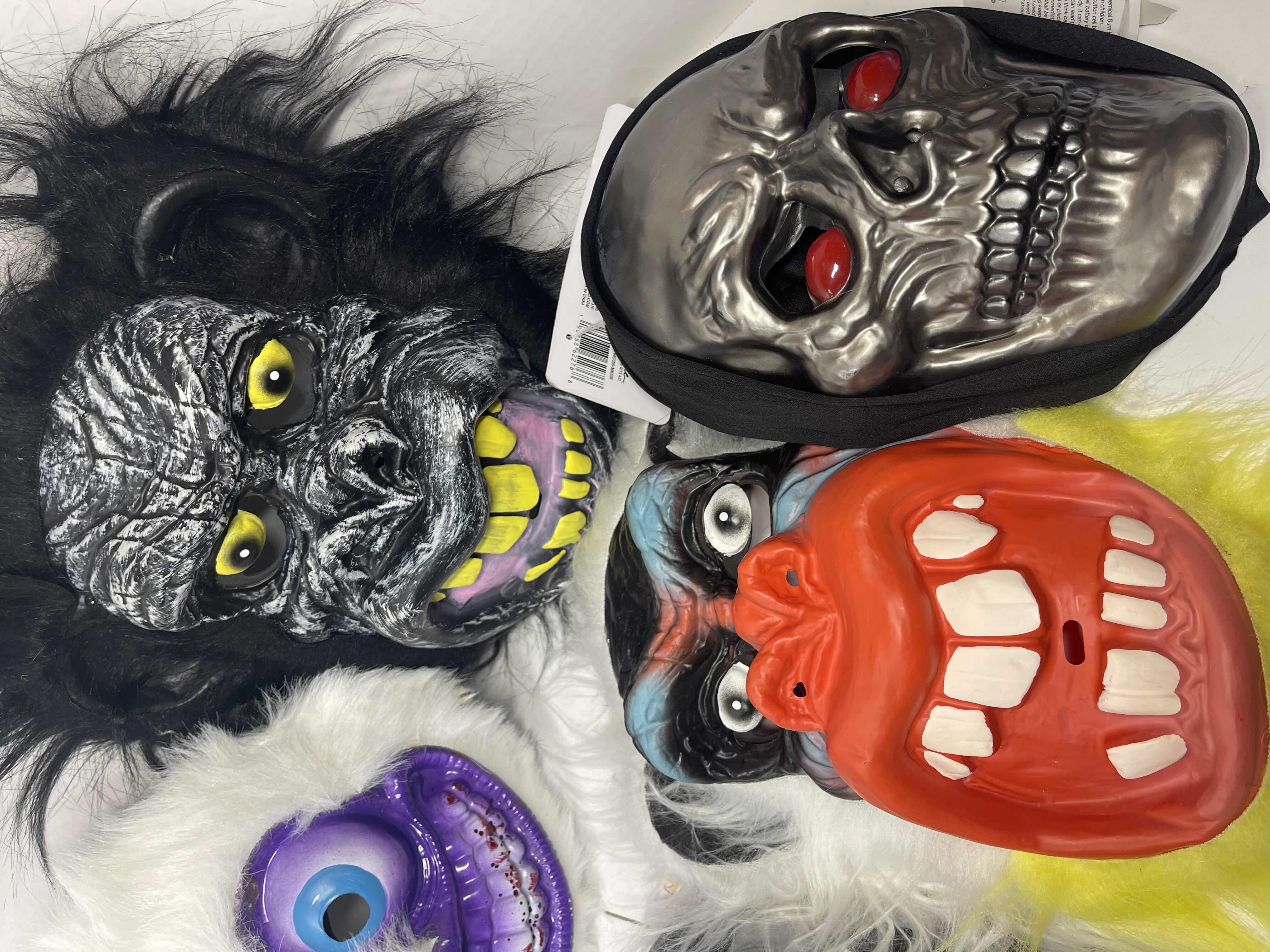 Photo 1 of HALLOWEEN PLASTIC MASKS (8) ONE SIZE FITS MOST ADULTS