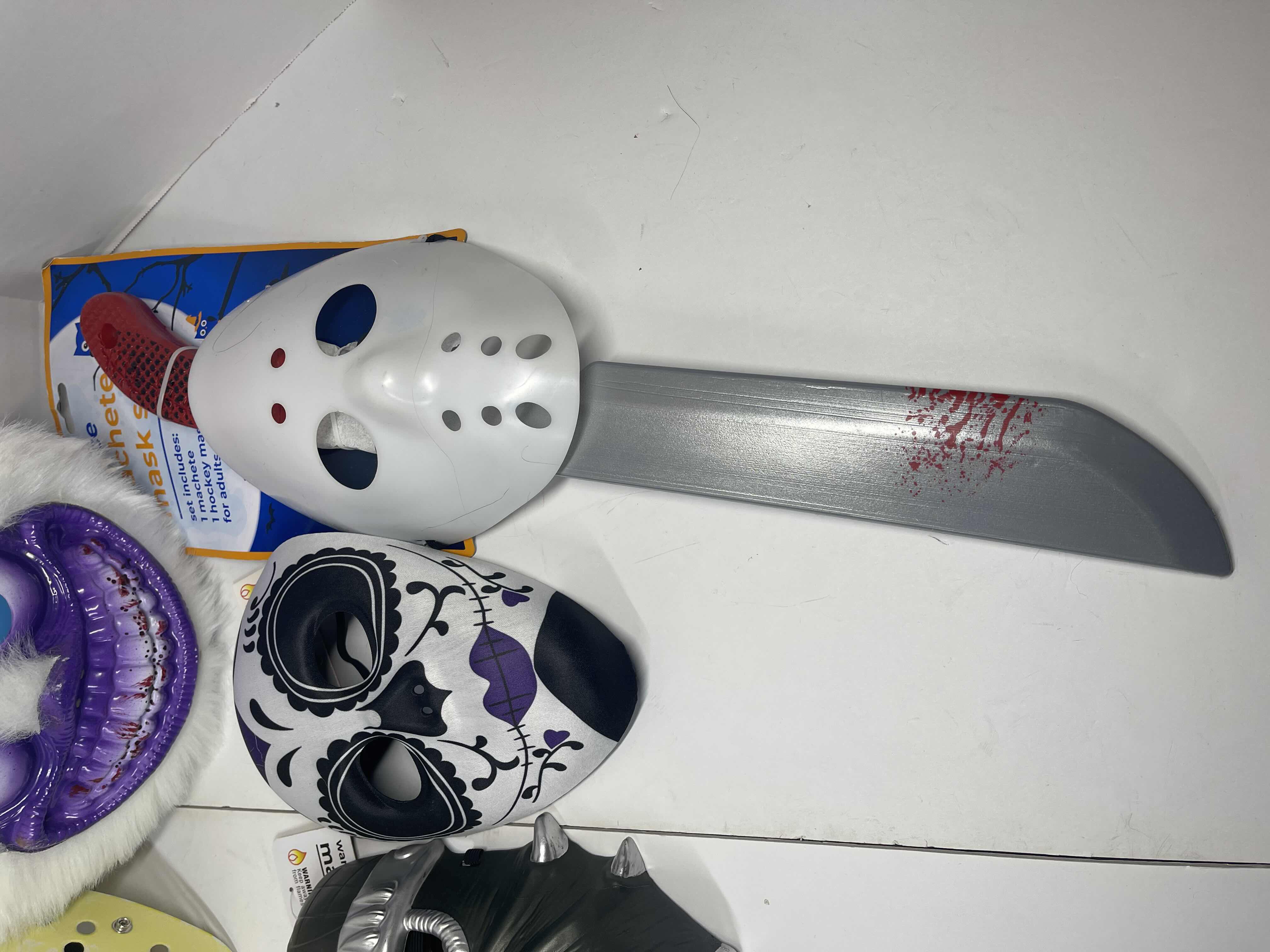 Photo 1 of HALLOWEEN PLASTIC MASKS (7) ONE SIZE FITS MOST ADULTS