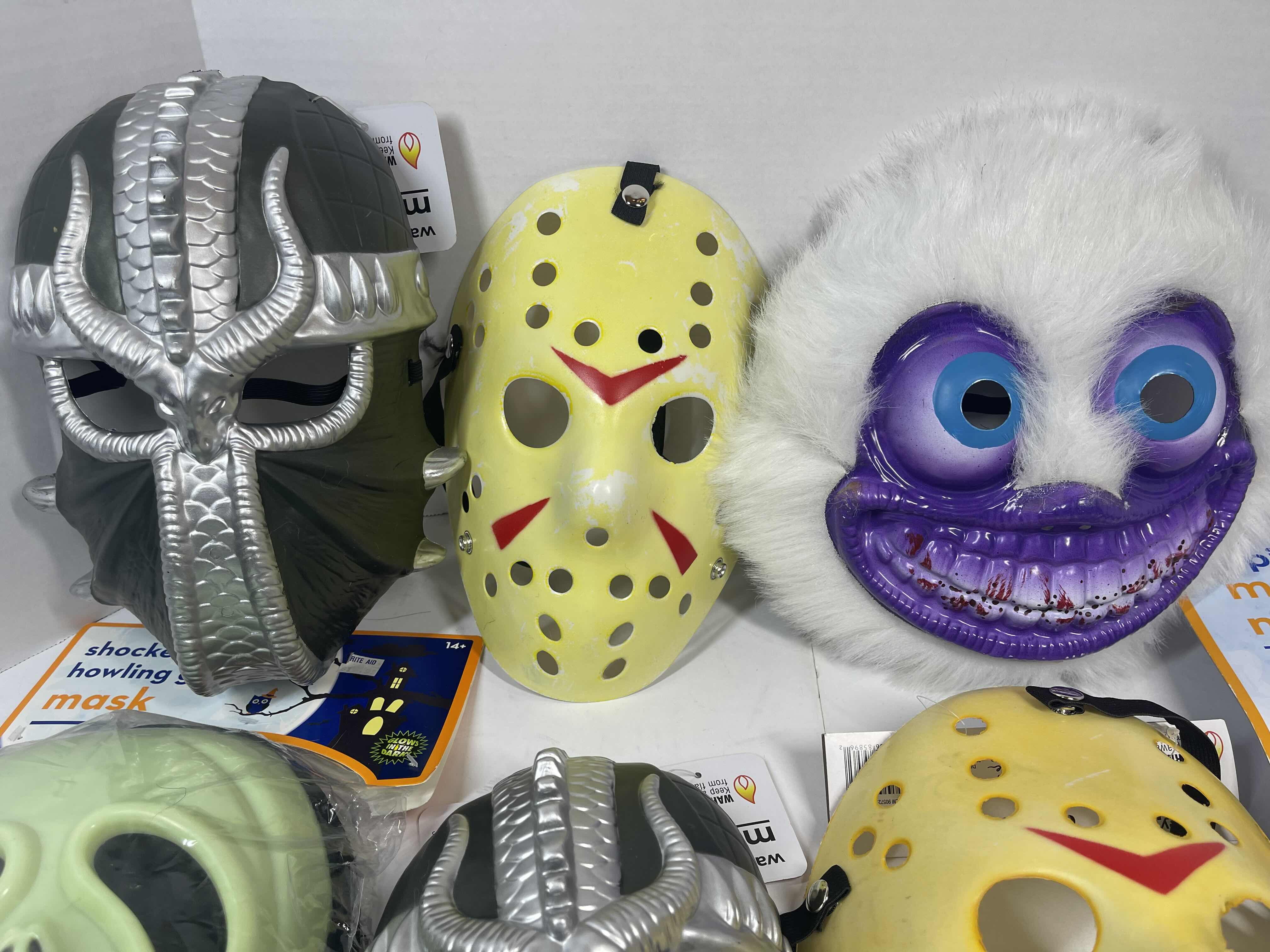 Photo 1 of HALLOWEEN PLASTIC MASKS (7) ONE SIZE FITS MOST ADULTS