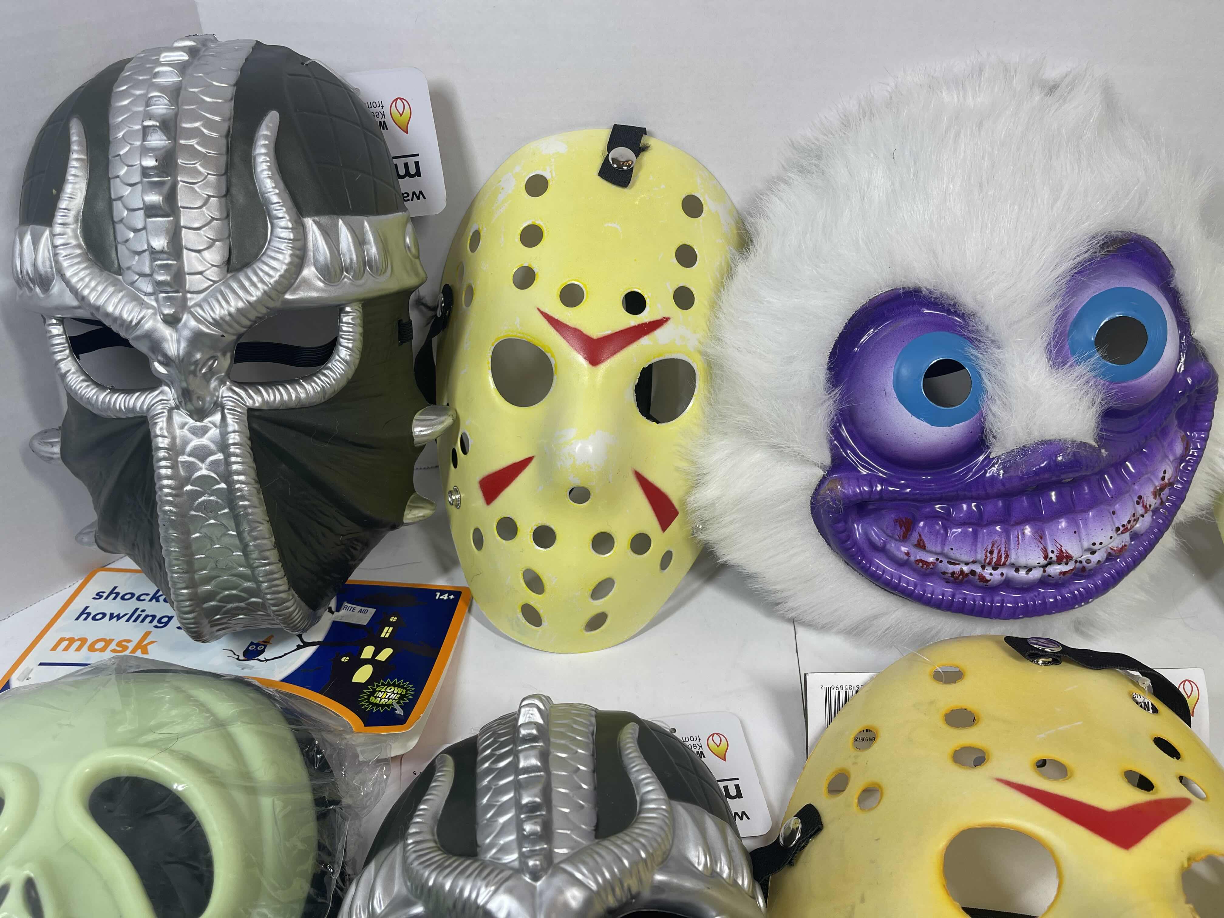 Photo 1 of HALLOWEEN PLASTIC MASKS (8) ONE SIZE FITS MOST ADULTS