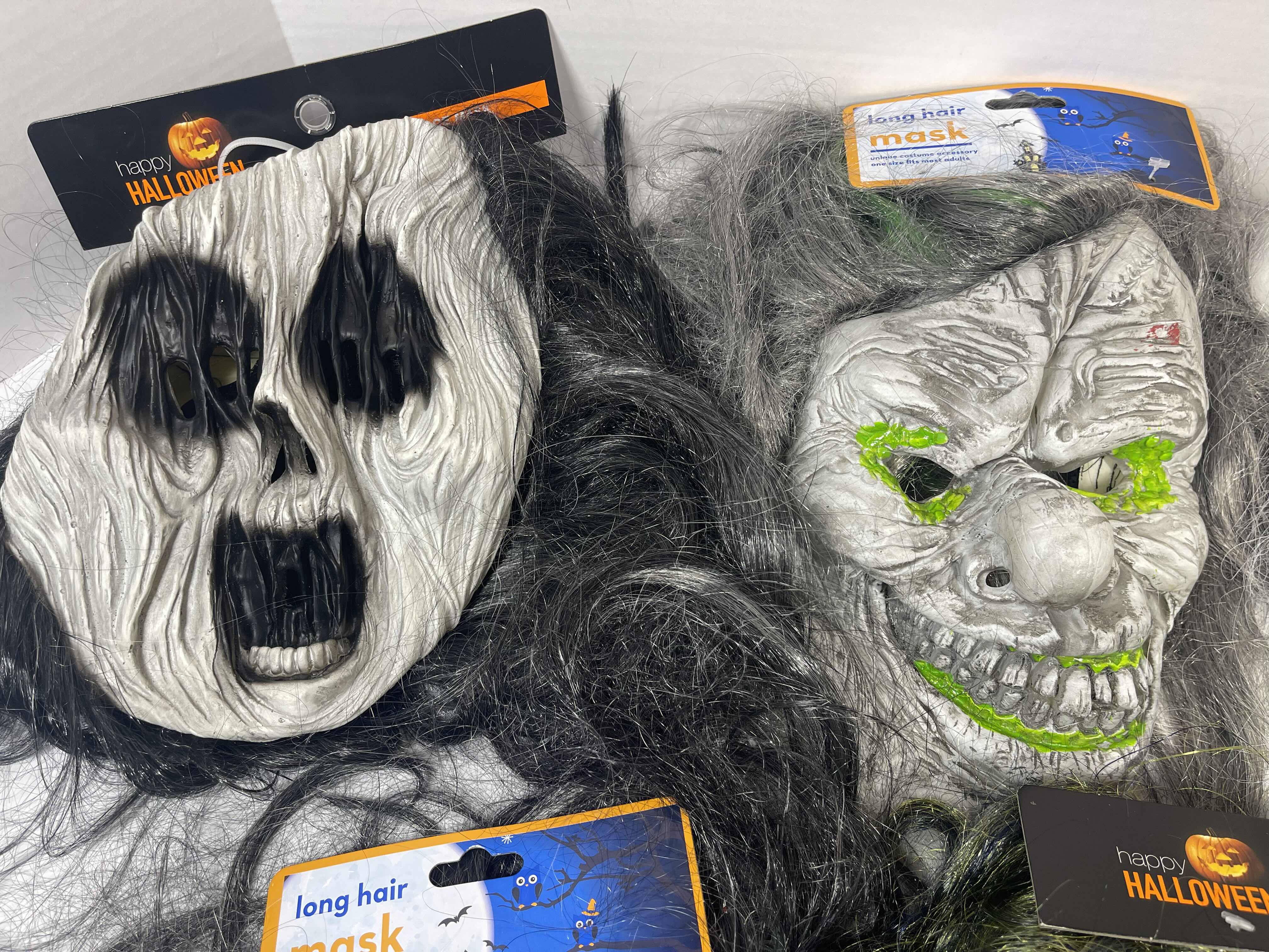 Photo 1 of HALLOWEEN RUBBER MASKS WITH HAIR (5) ONE SIZE FITS MOST ADULTS MSRP $80