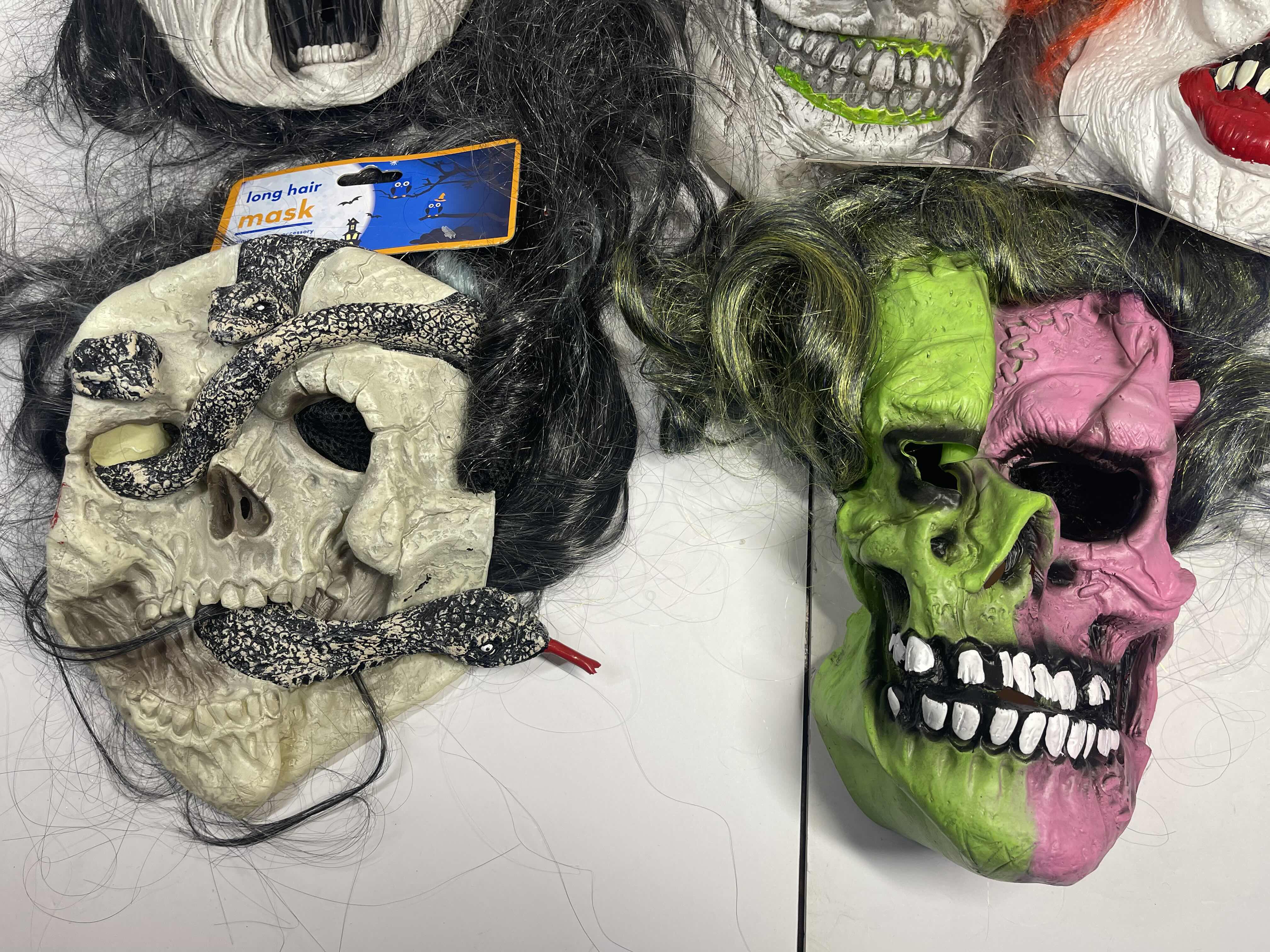 Photo 1 of HALLOWEEN RUBBER MASKS WITH HAIR (5) ONE SIZE FITS MOST ADULTS MSRP $80