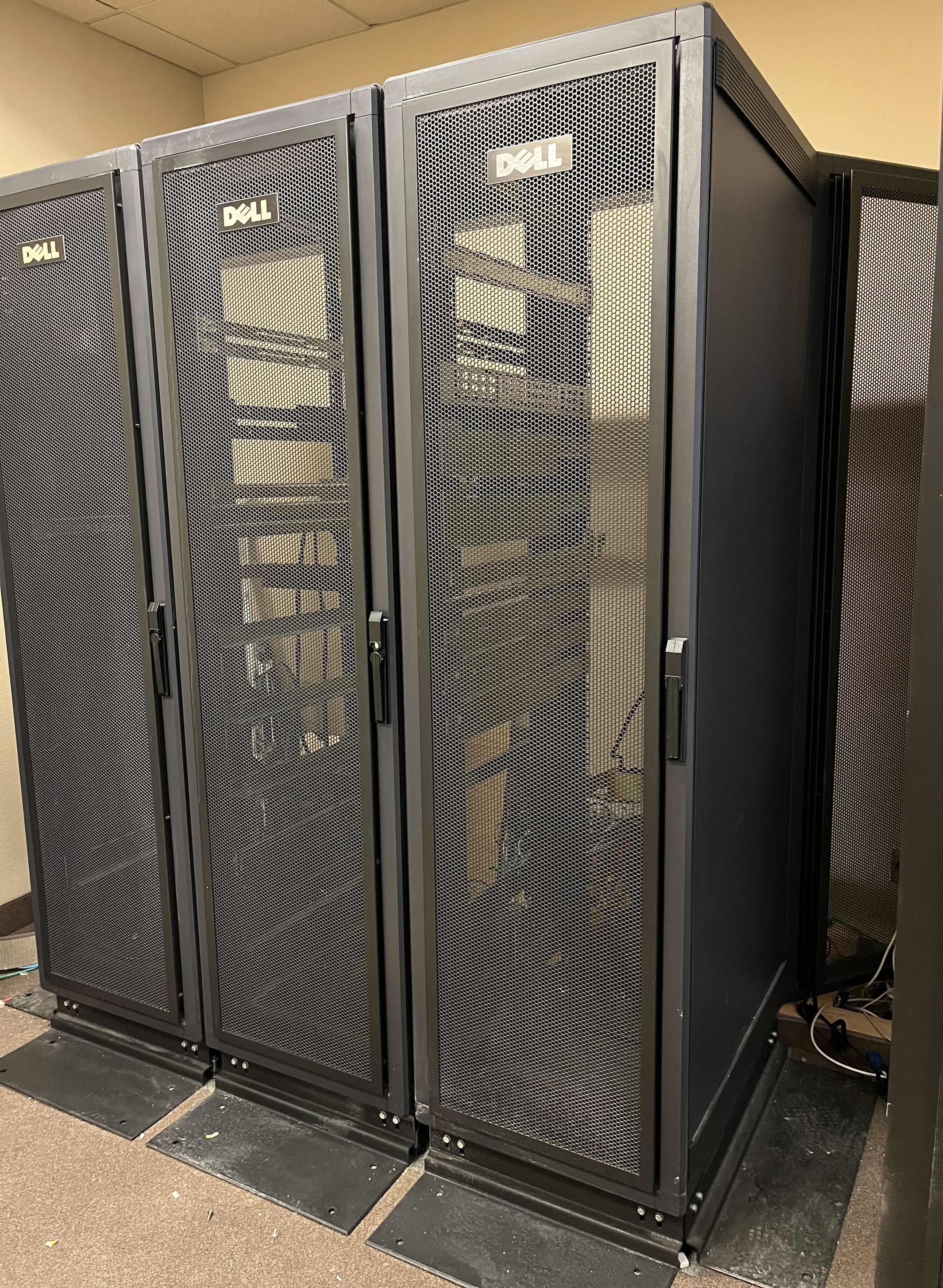 Photo 1 of DELL DOUBLE SIDED DOORS 3 RACK SET SERVER RACKS MODEL RML SERIAL NO. 7GMDA W 5 INSTALLED POWER STRIPS 88” X 45” H84.5” (READ NOTES)