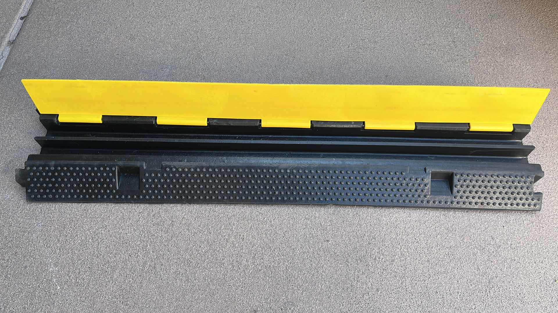 Photo 1 of RUBBER 2 CHANNEL CABLE/CORD PROTECTOR 39.5” X 9.5” H2”