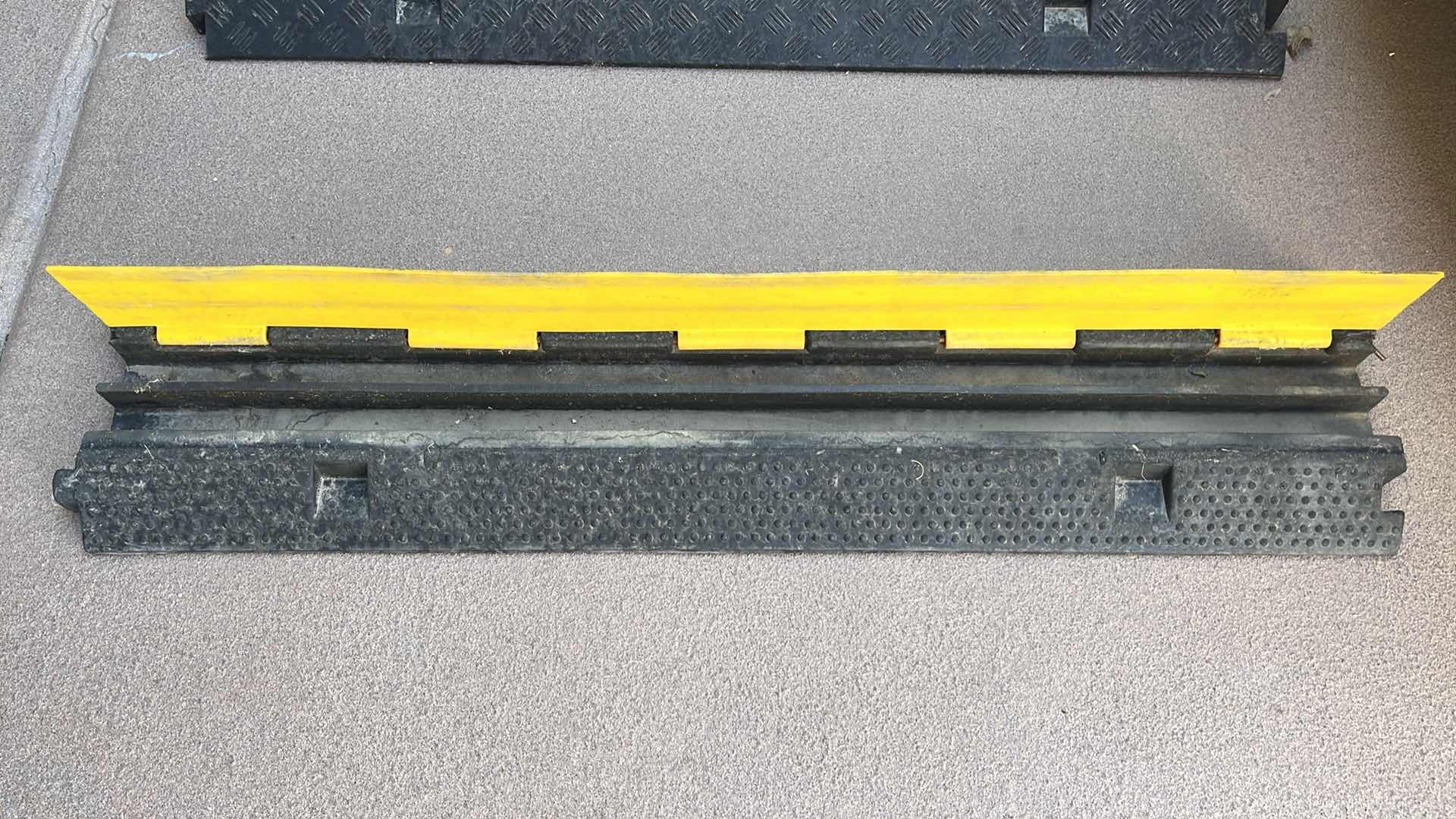 Photo 1 of RUBBER 2 CHANNEL CABLE/CORD PROTECTOR 39.5” X 9.5” H2”