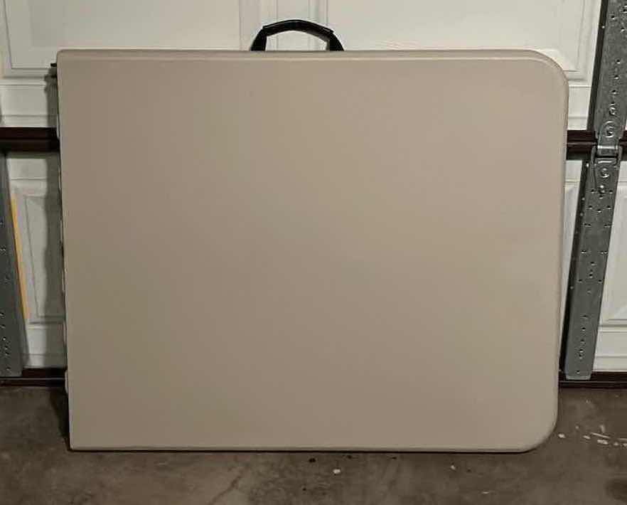 Photo 1 of PORTABLE 6FT FOLDING TABLE 72” X 29.25” H29.25”