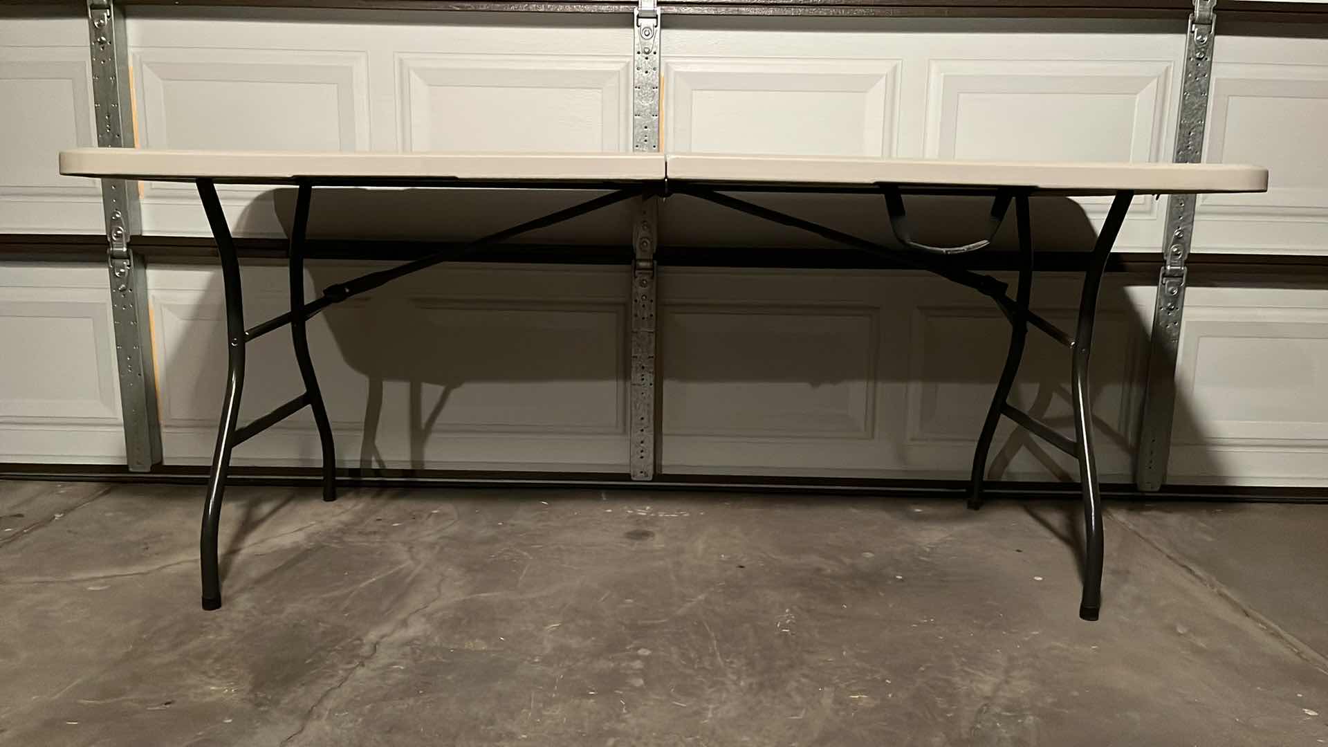 Photo 1 of PORTABLE 6FT FOLDING TABLE 72” X 29.25” H29.25”