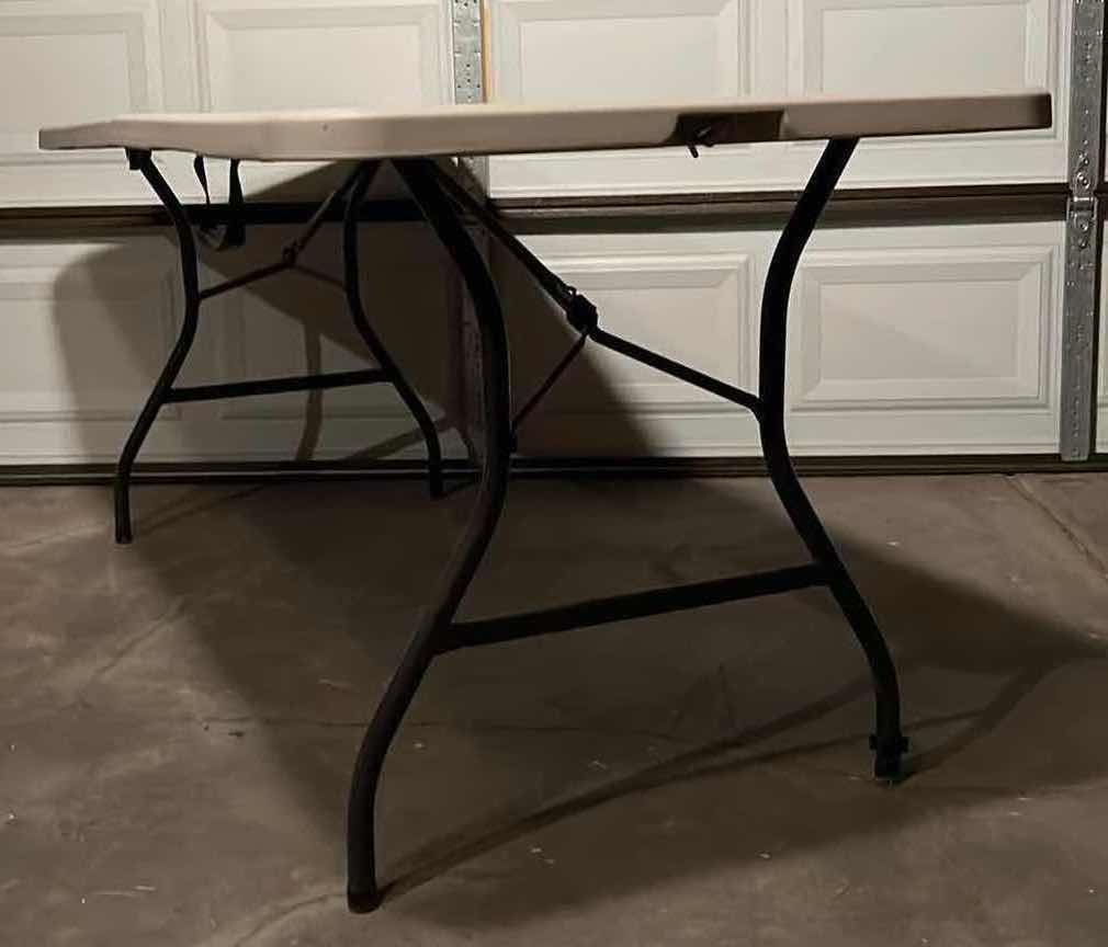 Photo 1 of PORTABLE 6FT FOLDING TABLE 72” X 29.25” H29.25”
