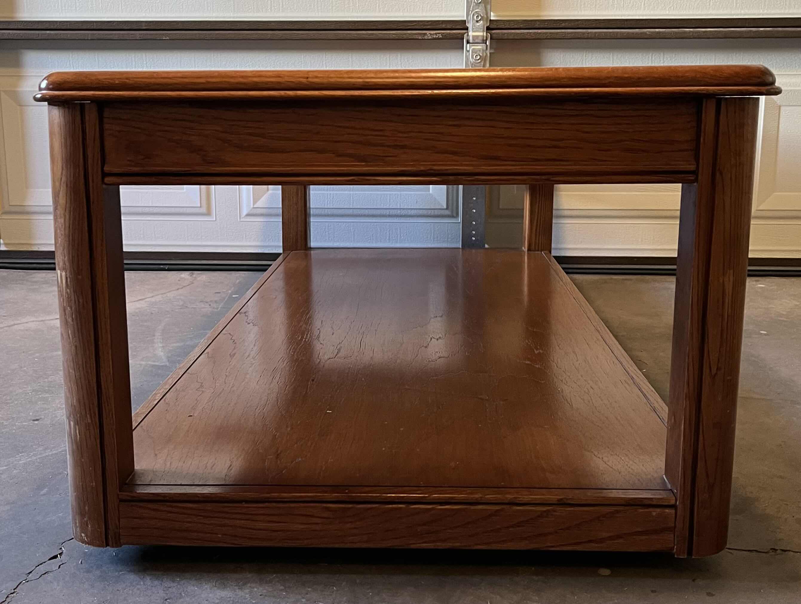 Photo 1 of OAK WOOD FINISH ROLLING COFFEE TABLE 52” X 24” H17”