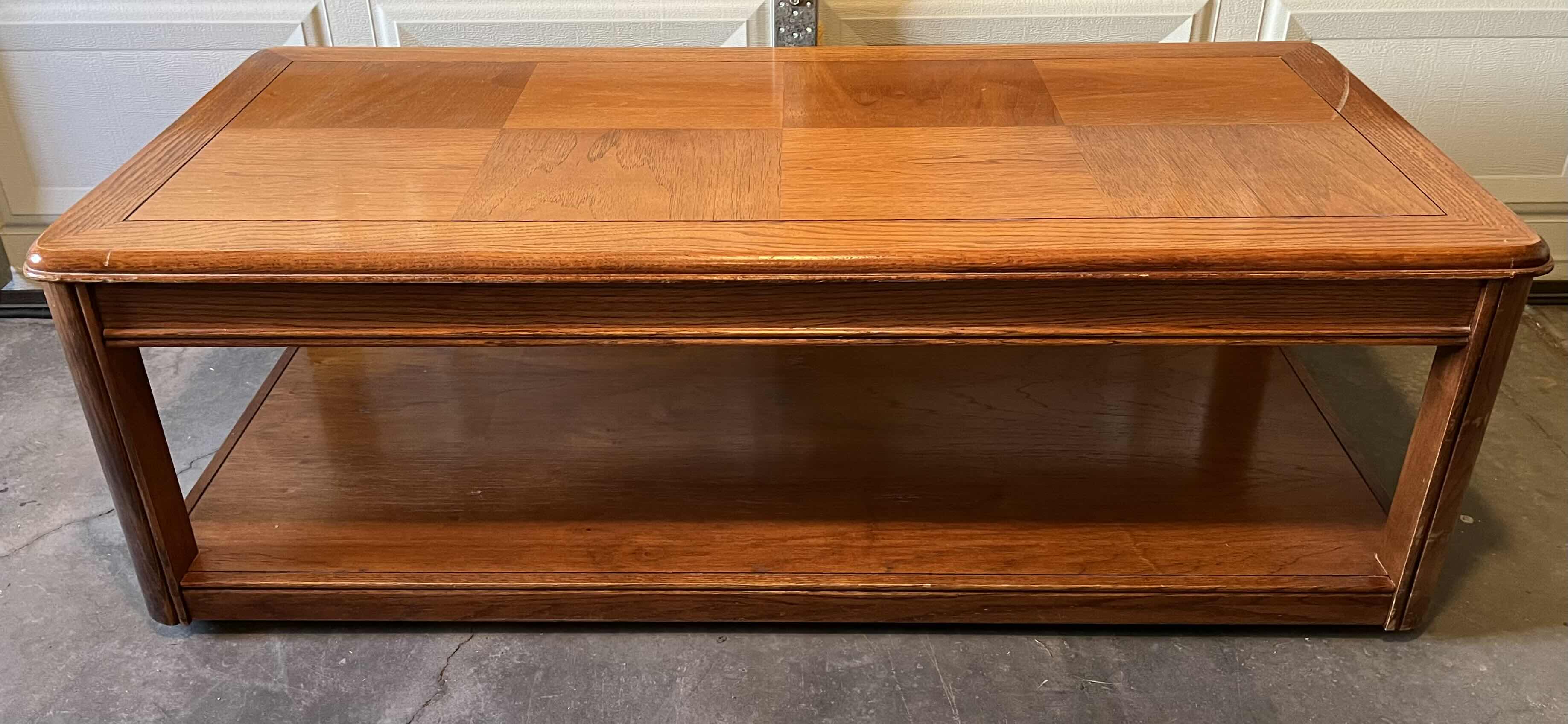 Photo 1 of OAK WOOD FINISH ROLLING COFFEE TABLE 52” X 24” H17”