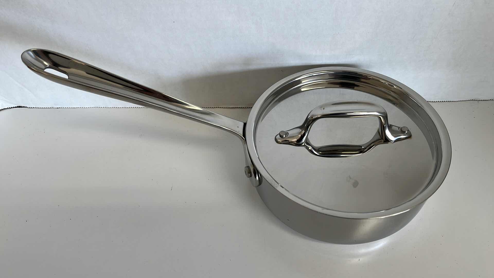 Photo 1 of ALL CLAD STAINLESS STEEL PAN W LID 6” X 2.25”