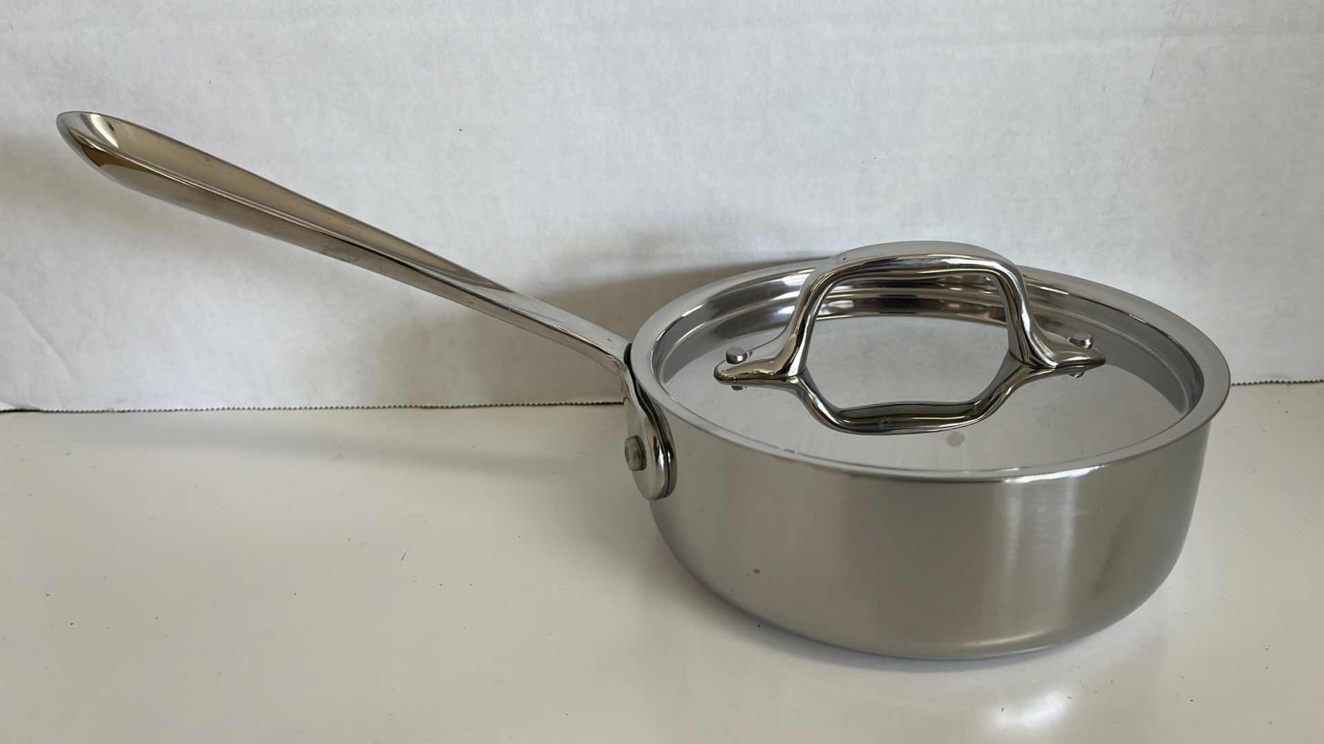 Photo 1 of ALL CLAD STAINLESS STEEL PAN W LID 6” X 2.25”
