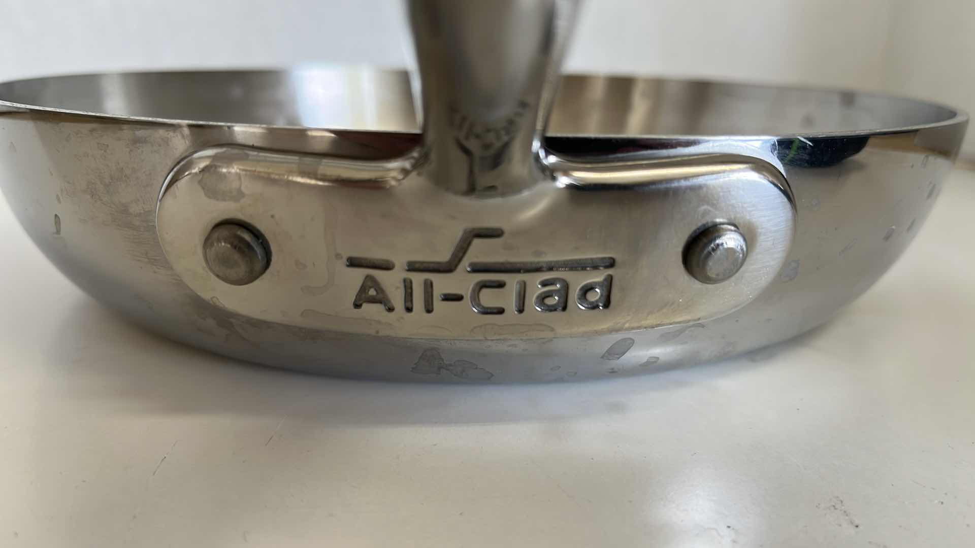 Photo 1 of   ALL CLAD STAINLESS STEEL SKILLET 9.5” X 1.75”