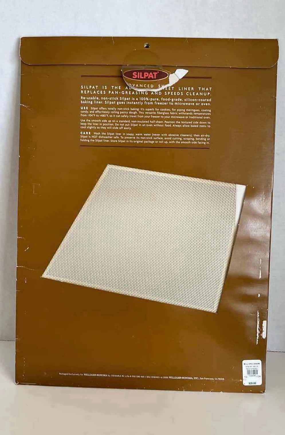Photo 1 of BAKING SHEET PANS 16” X 11” H1” (2) W RESTING RACK & SILPAT NON-STICK PAN LINER