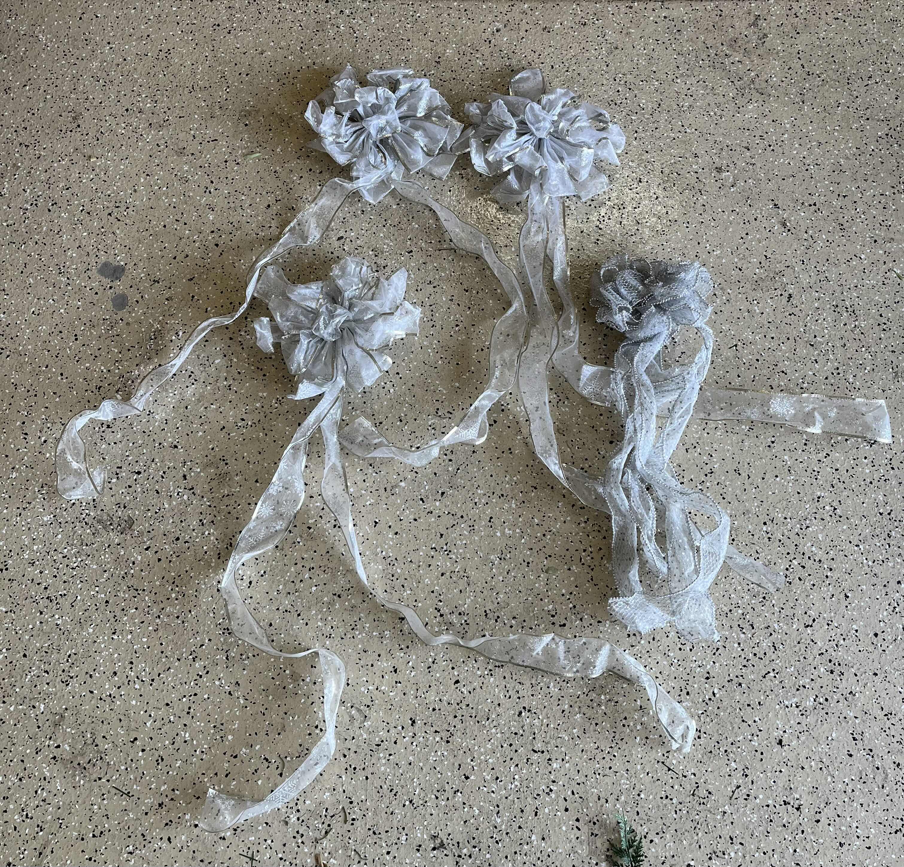 Photo 1 of CHRISTMAS LIGHT UP GARLANDS (2) & LIGHT UP PLANTERS (2) W BOWS (4)