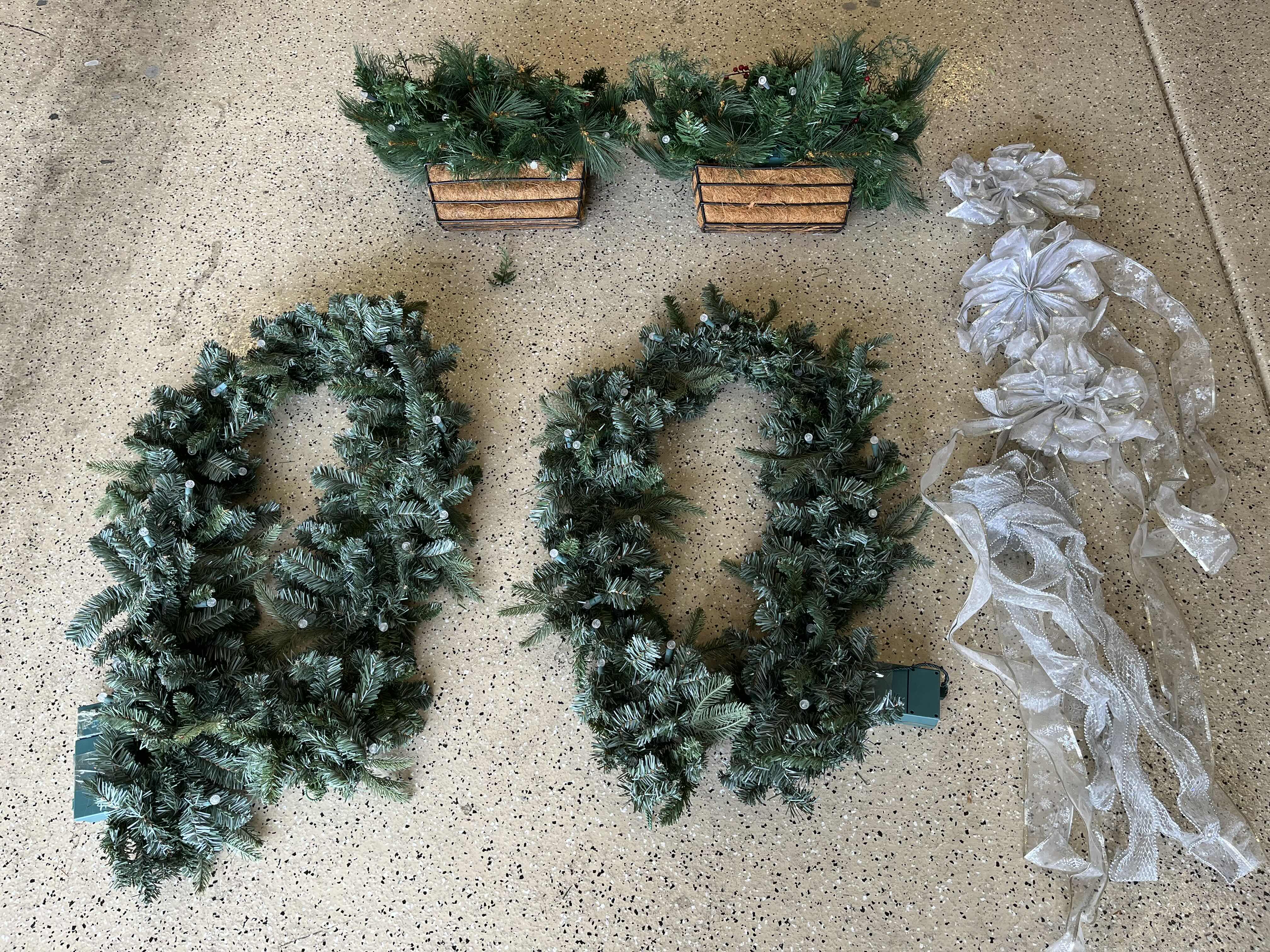 Photo 1 of CHRISTMAS LIGHT UP GARLANDS (2) & LIGHT UP PLANTERS (2) W BOWS (4)