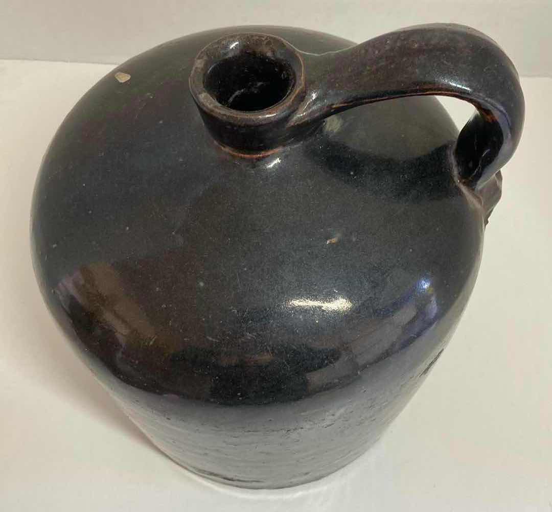 Photo 1 of ANTIQUE DARK BROWN STONEWARE WHISKEY JUG 8” X H9.5”