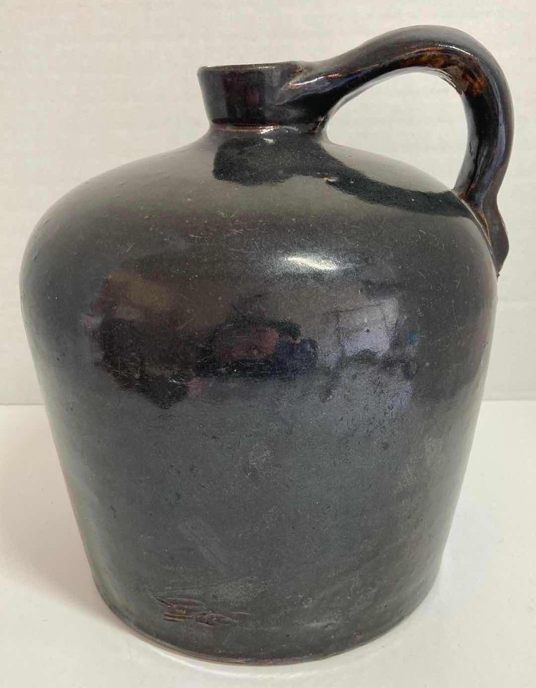 Photo 1 of ANTIQUE DARK BROWN STONEWARE WHISKEY JUG 8” X H9.5”