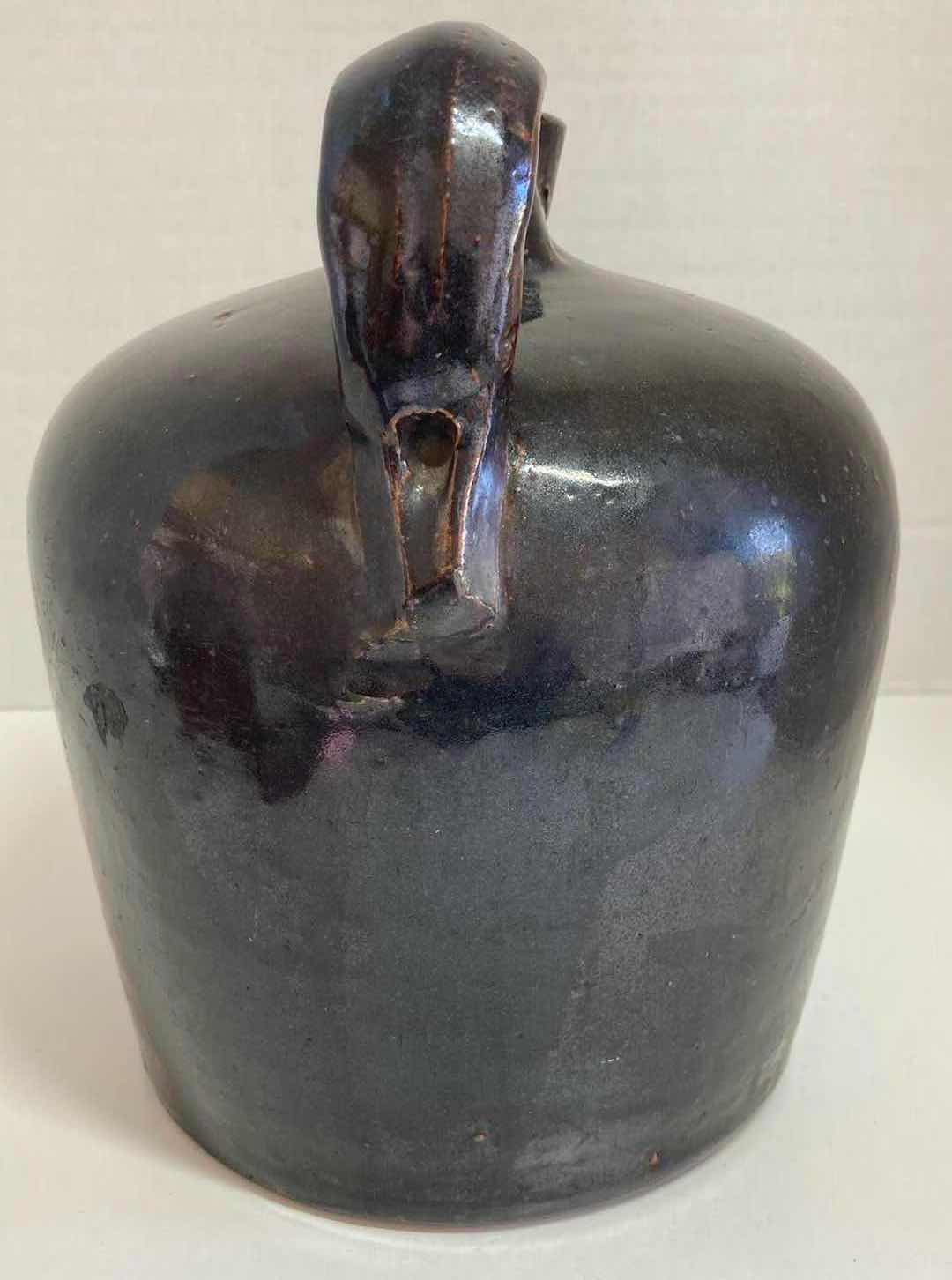 Photo 1 of ANTIQUE DARK BROWN STONEWARE WHISKEY JUG 8” X H9.5”