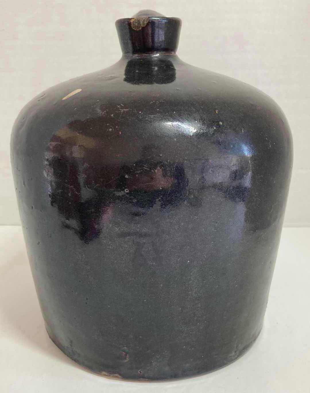 Photo 1 of ANTIQUE DARK BROWN STONEWARE WHISKEY JUG 8” X H9.5”