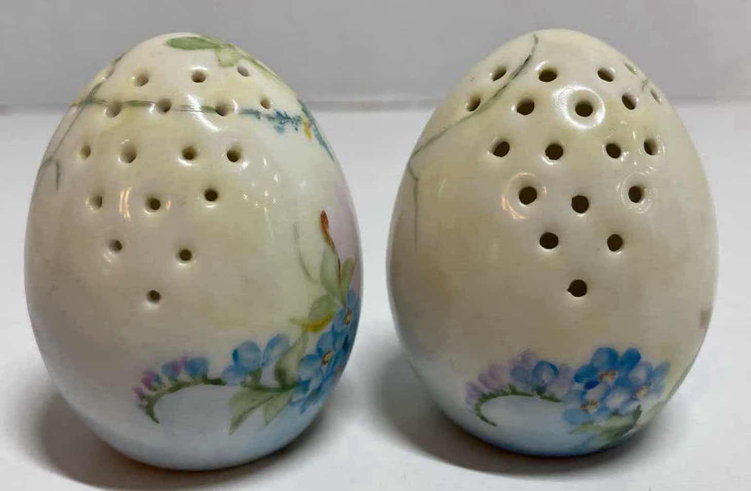 Photo 1 of GERMAN HAND PAINTED BLUE FLORAL PORCELAIN EGG-SHAPED SALT AND PEPPER SHAKER H2.5”